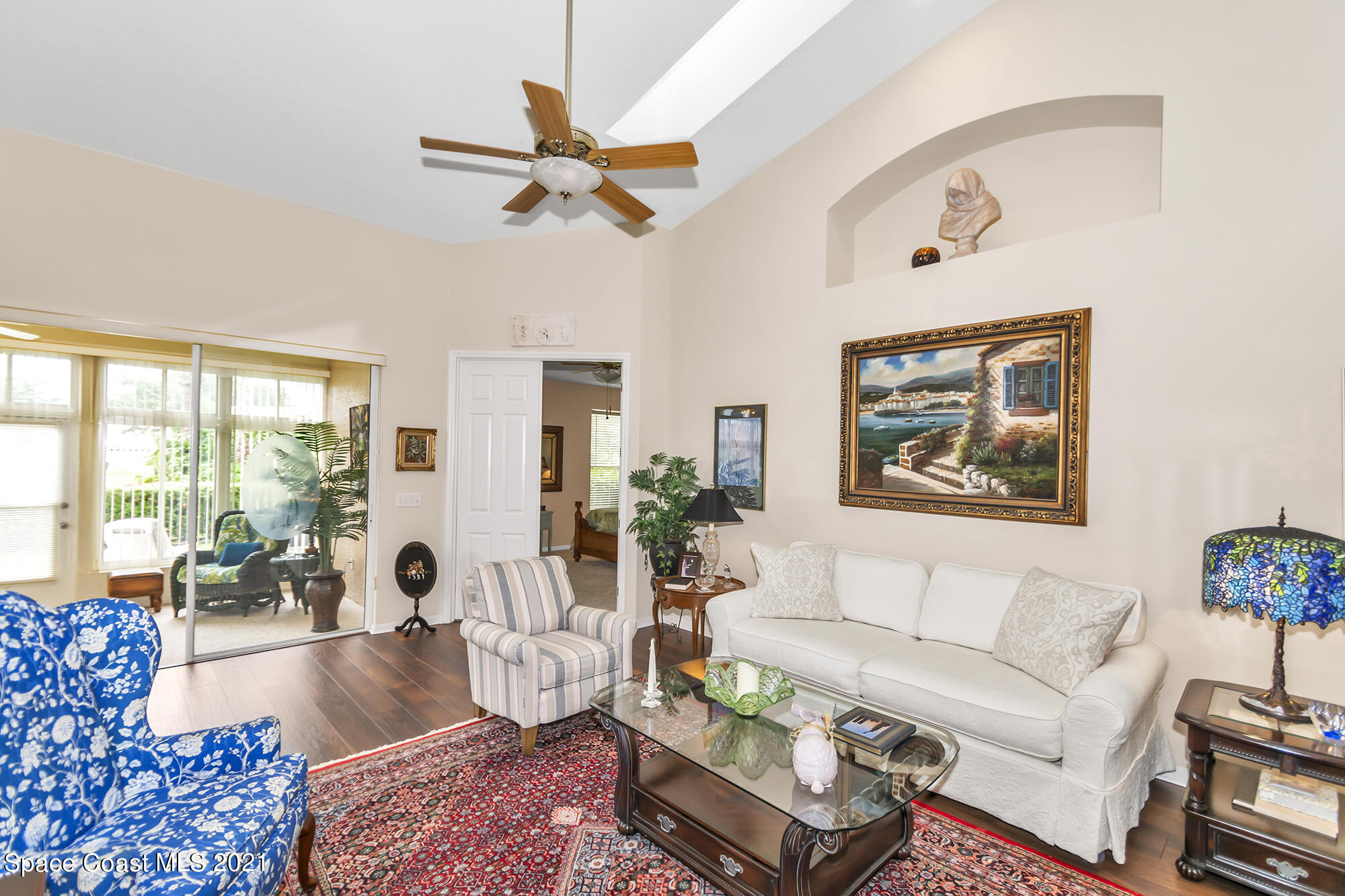 569 Renaissance Avenue Melbourne, FL 32940 - Photo 6 of 34 a living room with furniture and a large window