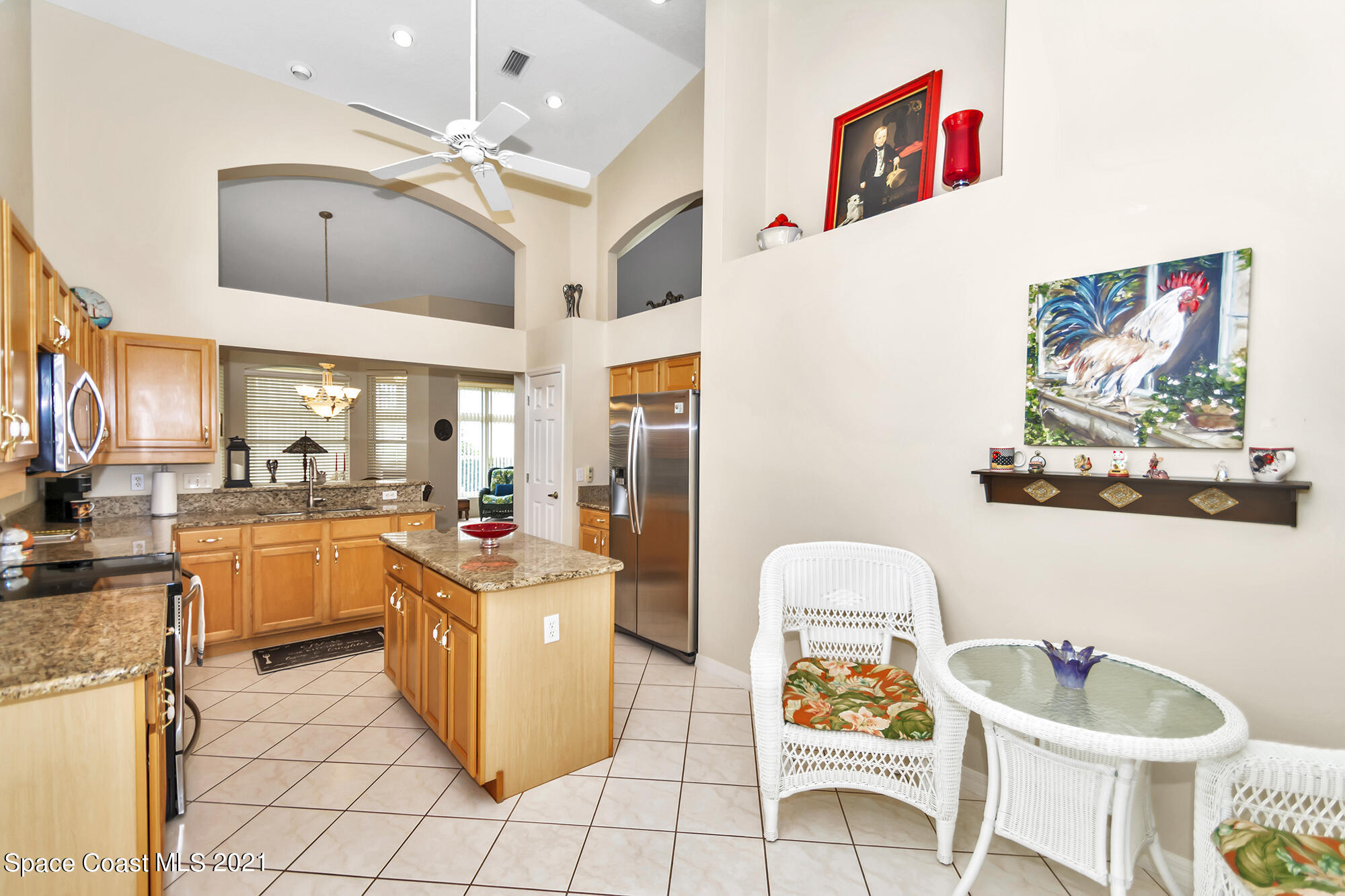 569 Renaissance Avenue Melbourne, FL 32940 - Photo 10 of 34 a kitchen with a sink and cabinets