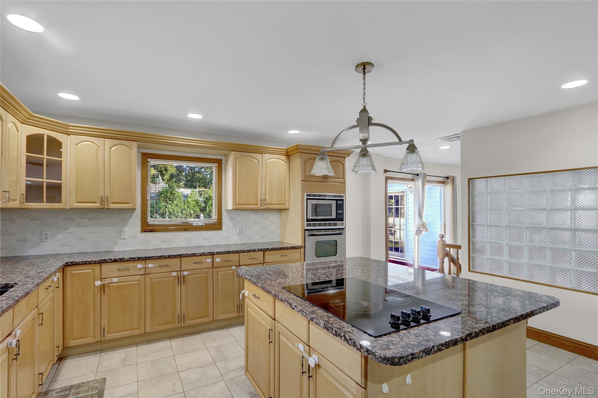 600 Plainview Road Plainview, NY 11803 - Photo 17 of 41 a kitchen with stainless steel appliances granite countertop a sink a counter top space and cabinets