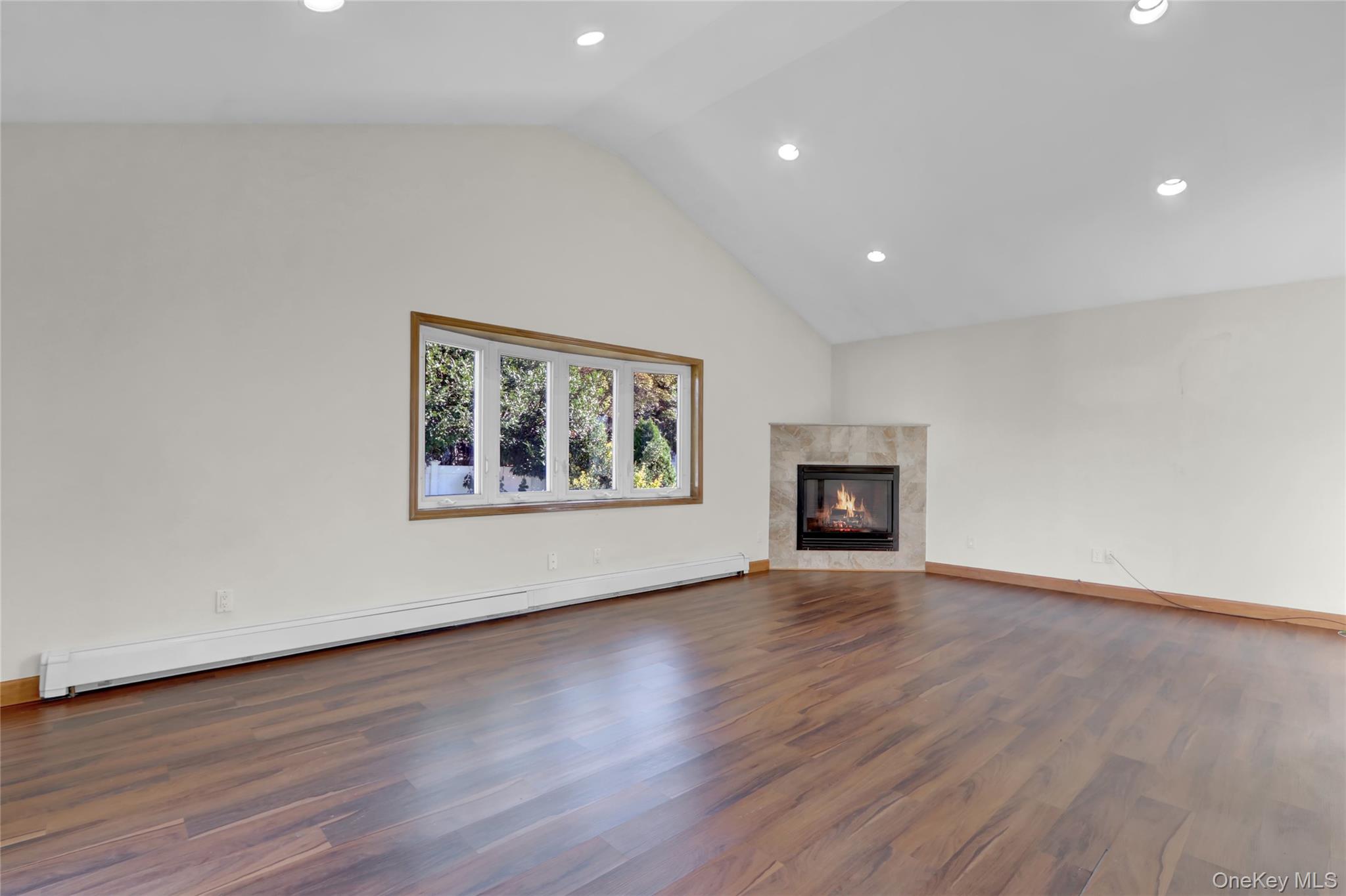 600 Plainview Road Plainview, NY 11803 - Photo 18 of 41 a view of an empty room with wooden floor and a window