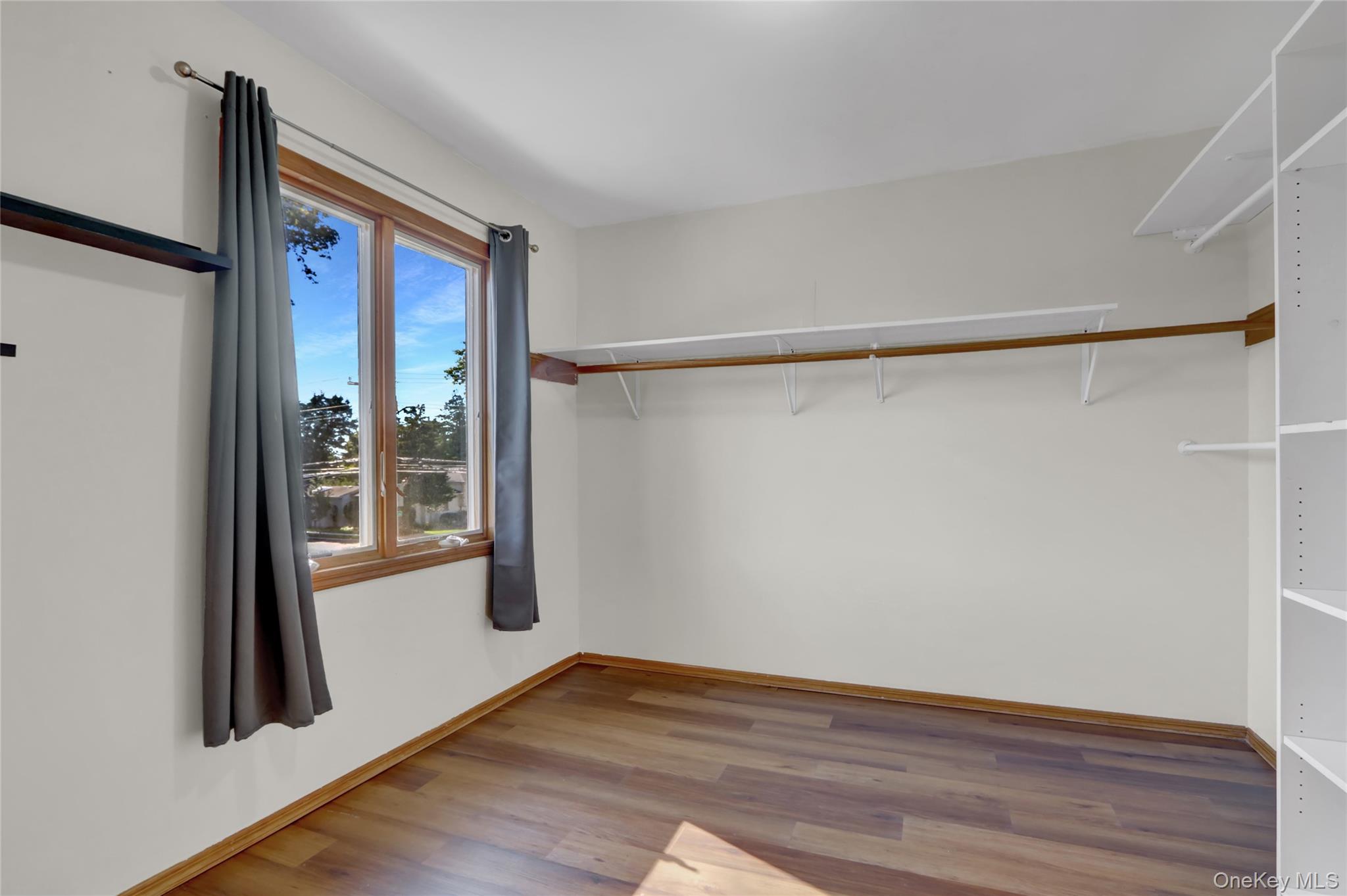 600 Plainview Road Plainview, NY 11803 - Photo 28 of 41 a view of front door with wooden floor