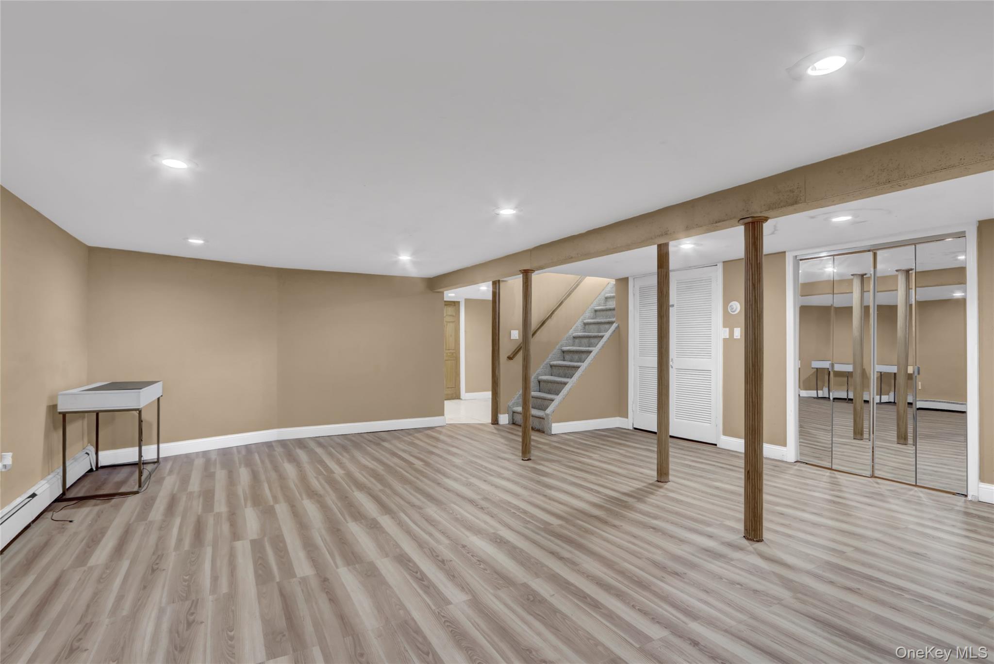 600 Plainview Road Plainview, NY 11803 - Photo 34 of 41 a view of an empty room with wooden floor and a window
