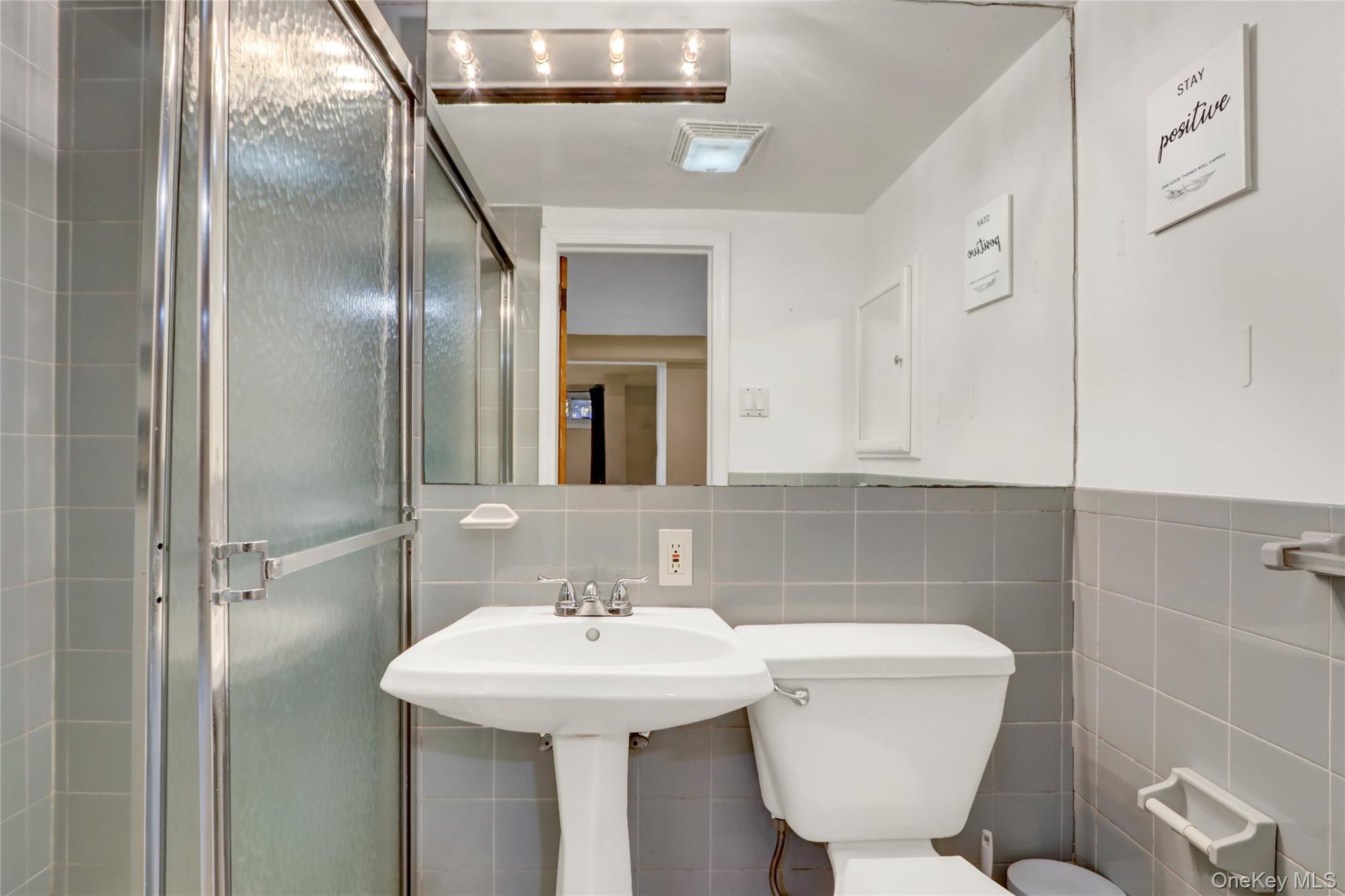 600 Plainview Road Plainview, NY 11803 - Photo 35 of 41 a bathroom with a toilet sink and mirror