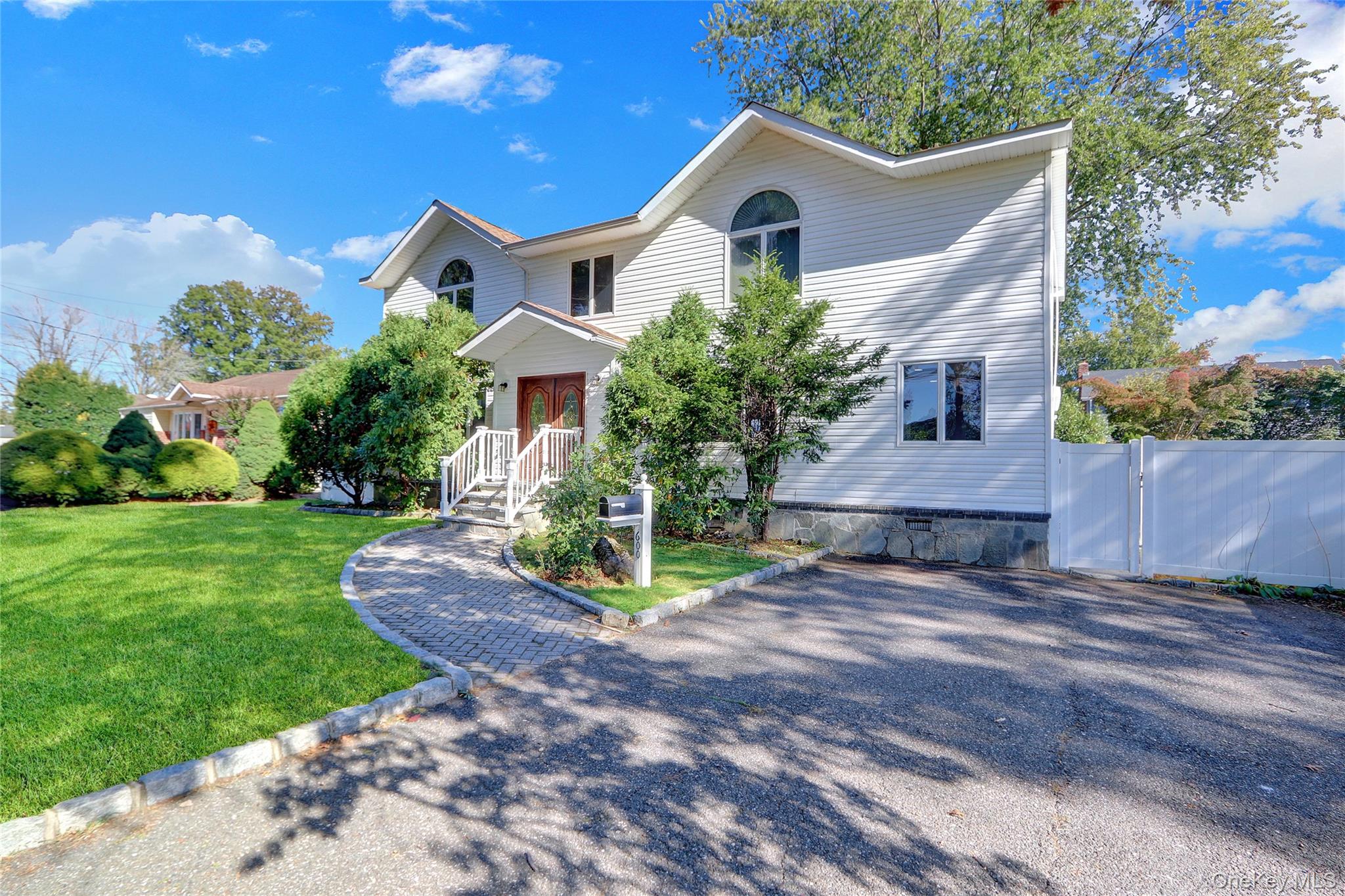 600 Plainview Road Plainview, NY 11803 - Photo 4 of 41 a front view of house with yard and green space