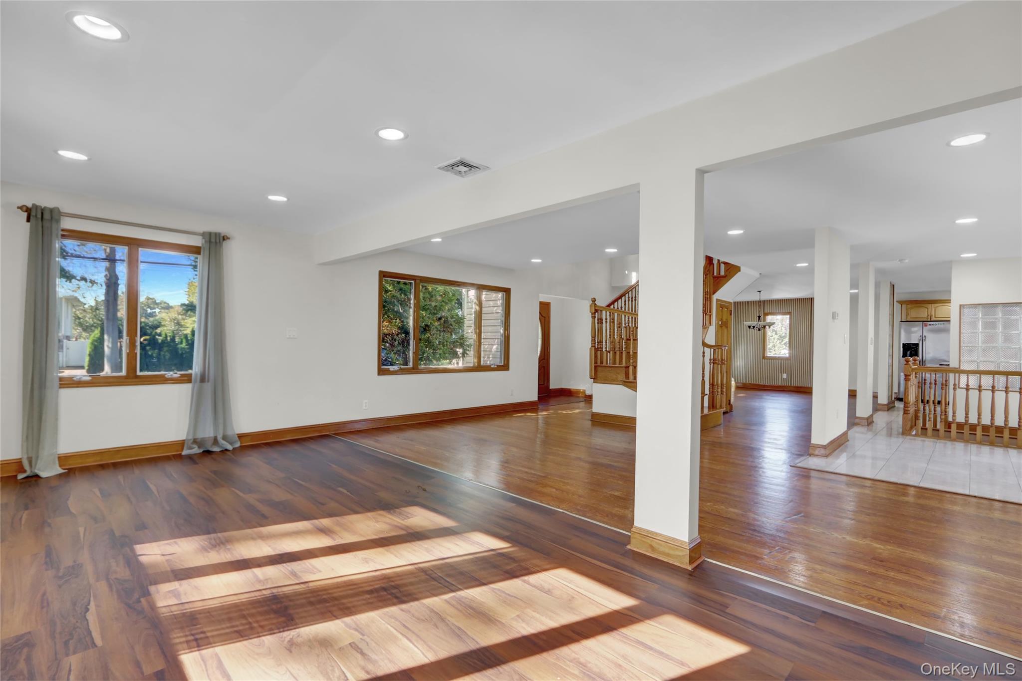 600 Plainview Road Plainview, NY 11803 - Photo 6 of 41 a view of an entryway with wooden floor and windows
