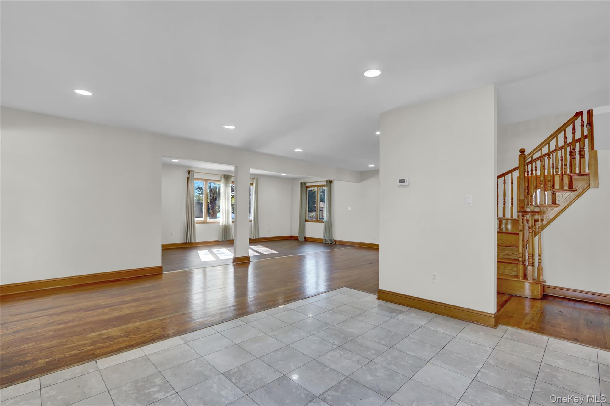 600 Plainview Road Plainview, NY 11803 - Photo 10 of 41 a view of empty room with wooden floor and fan