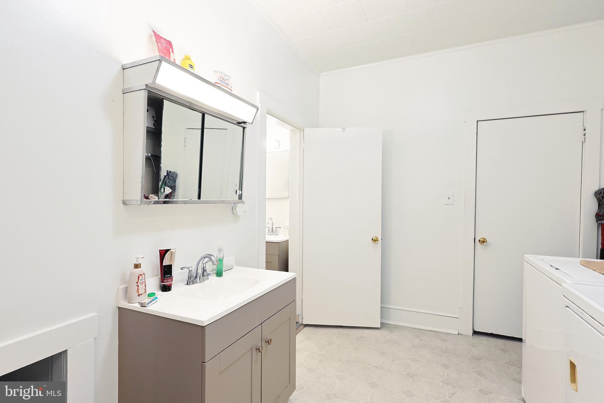 11305 Creek Road Southeast Cumberland, MD 21502 - Photo 20 of 47 a bathroom with a sink vanity and mirror