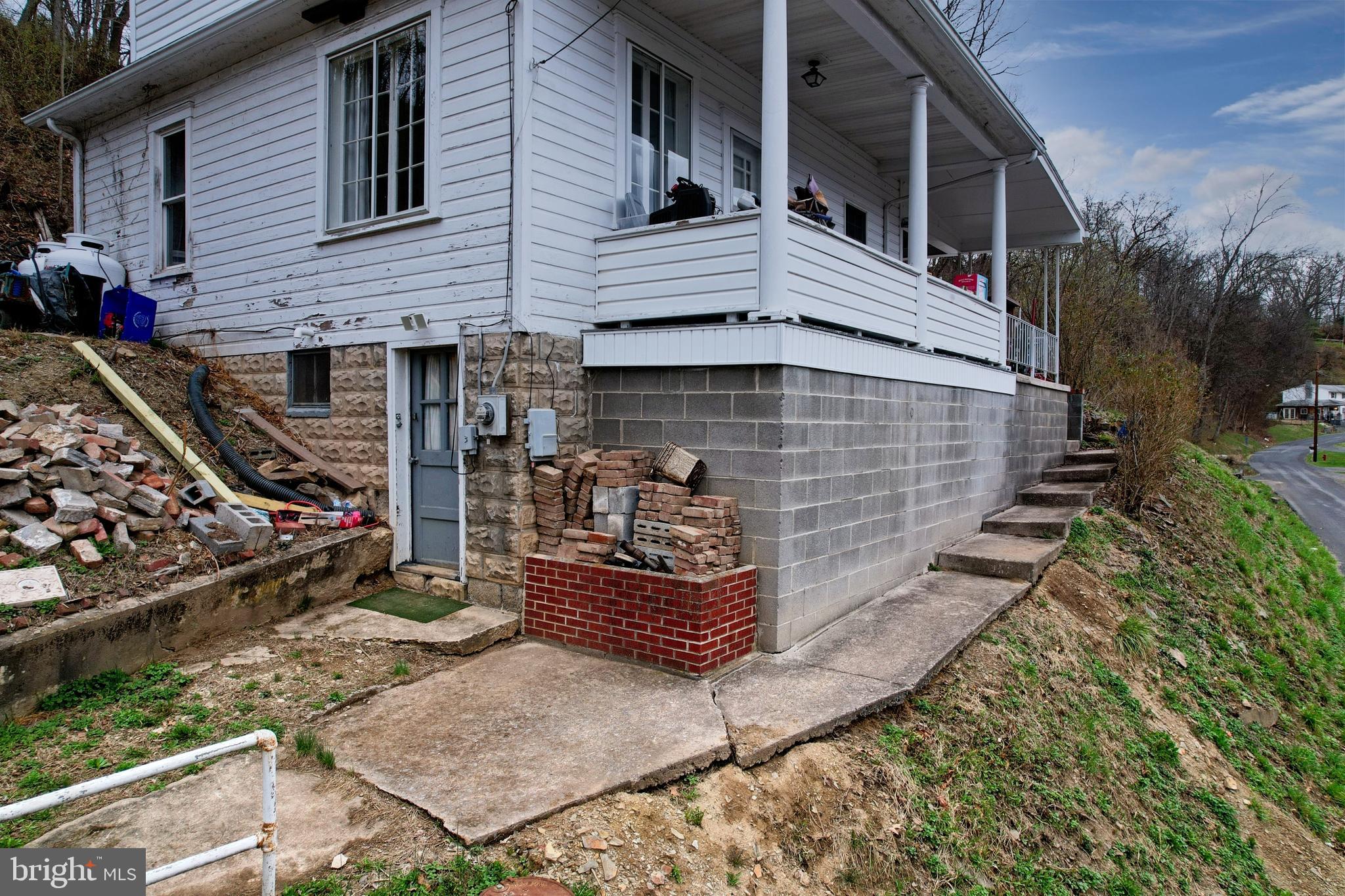 11305 Creek Road Southeast Cumberland, MD 21502 - Photo 39 of 47 a front view of a house with barbeque area