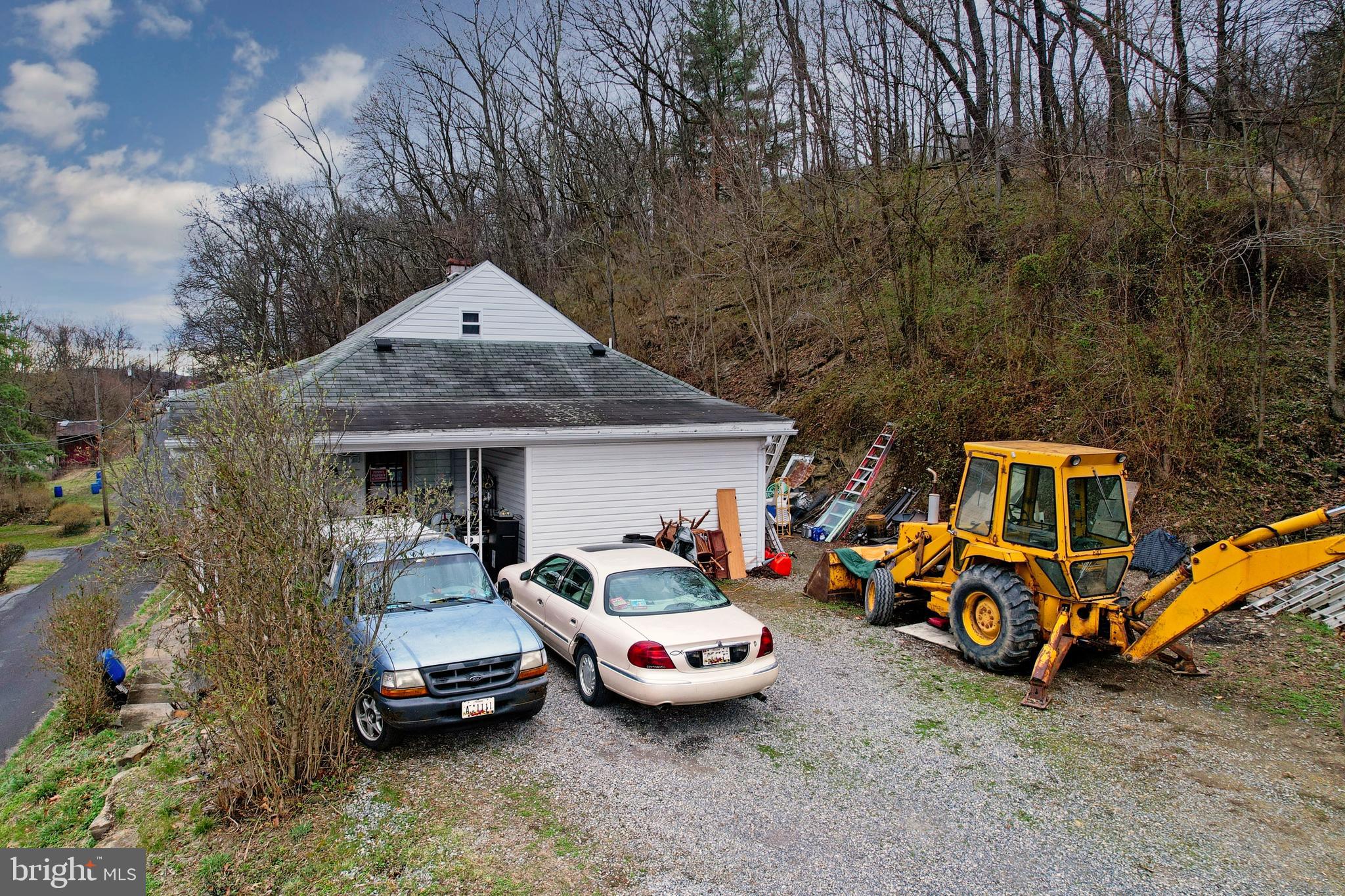 11305 Creek Road Southeast Cumberland, MD 21502 - Photo 41 of 47 a front view of a house with cars parked