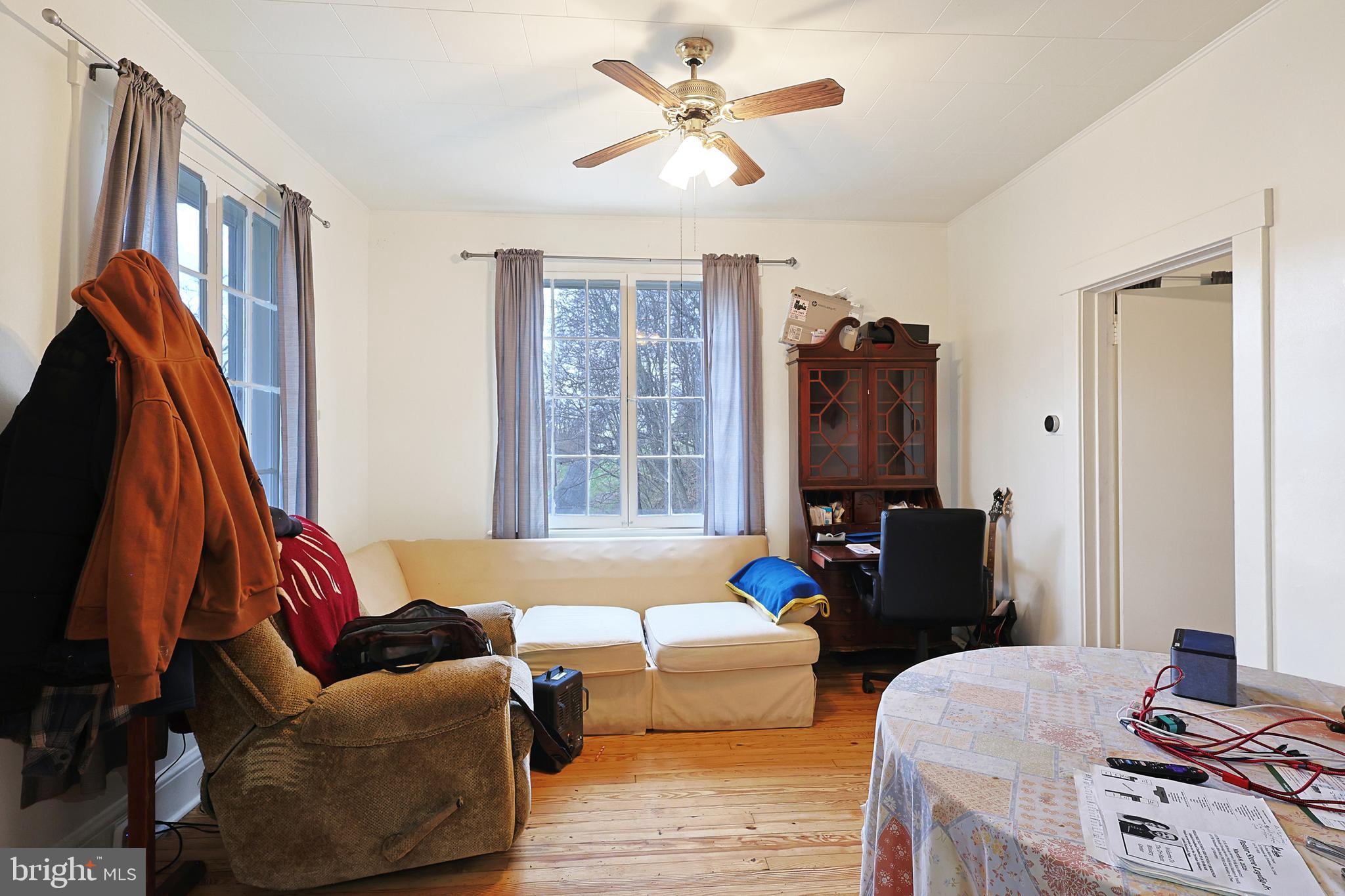 11305 Creek Road Southeast Cumberland, MD 21502 - Photo 8 of 47 a living room with furniture and a window