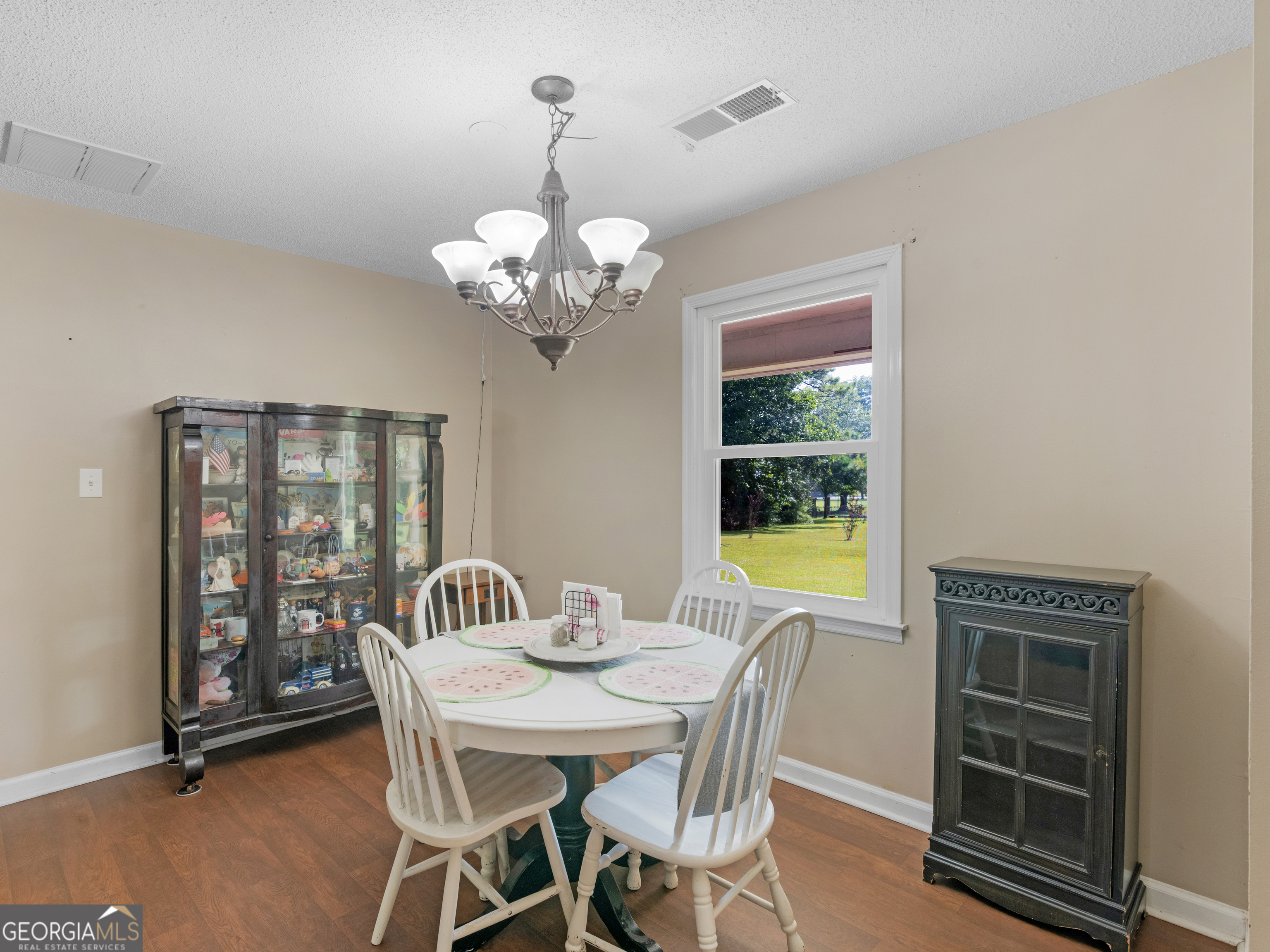 4939 Highway 19 Zebulon, GA 30295 - Photo 12 of 70 a view of a dining room with furniture wooden floor and chandelier