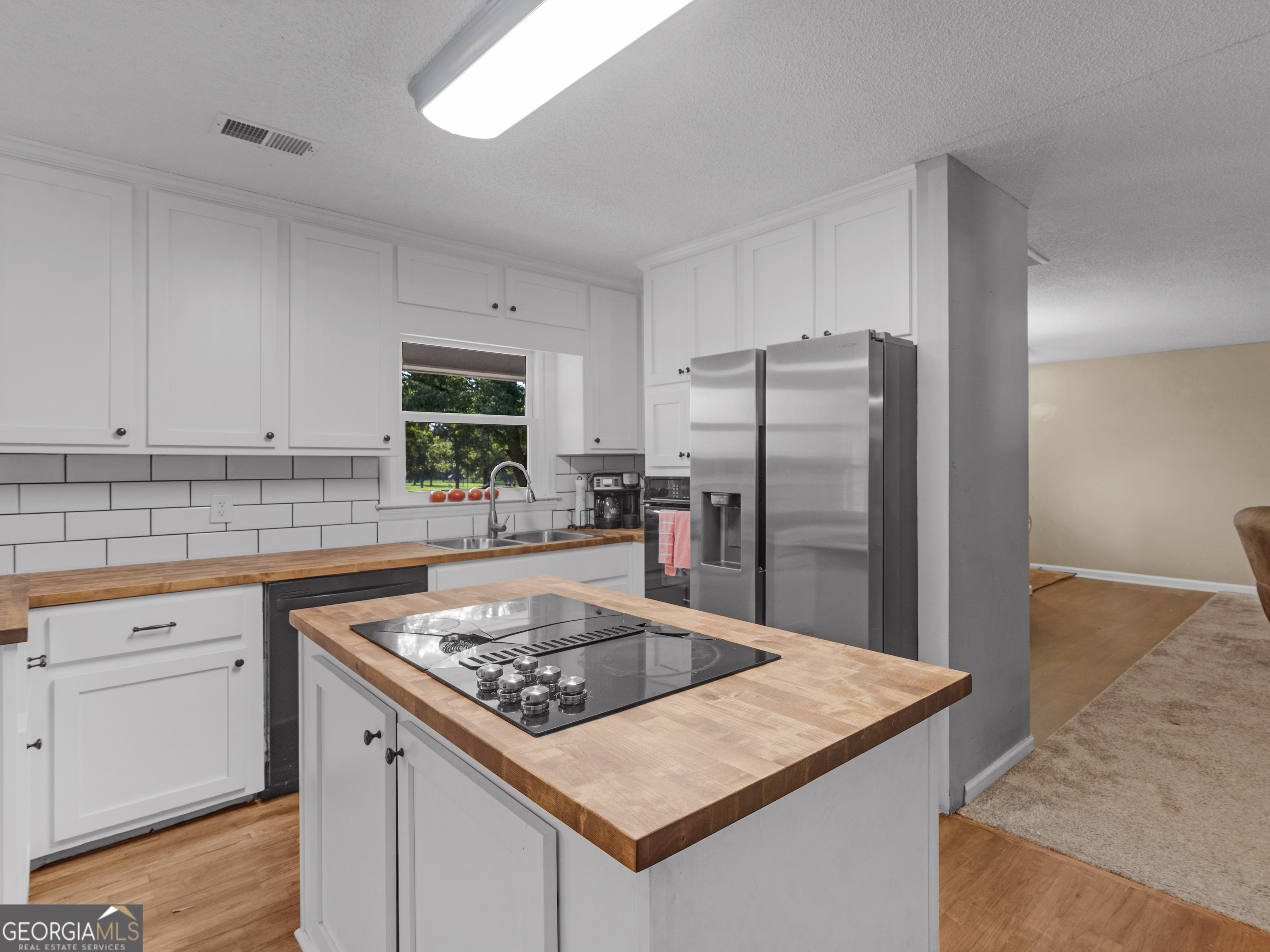 4939 Highway 19 Zebulon, GA 30295 - Photo 14 of 70 a kitchen with a refrigerator sink and stove