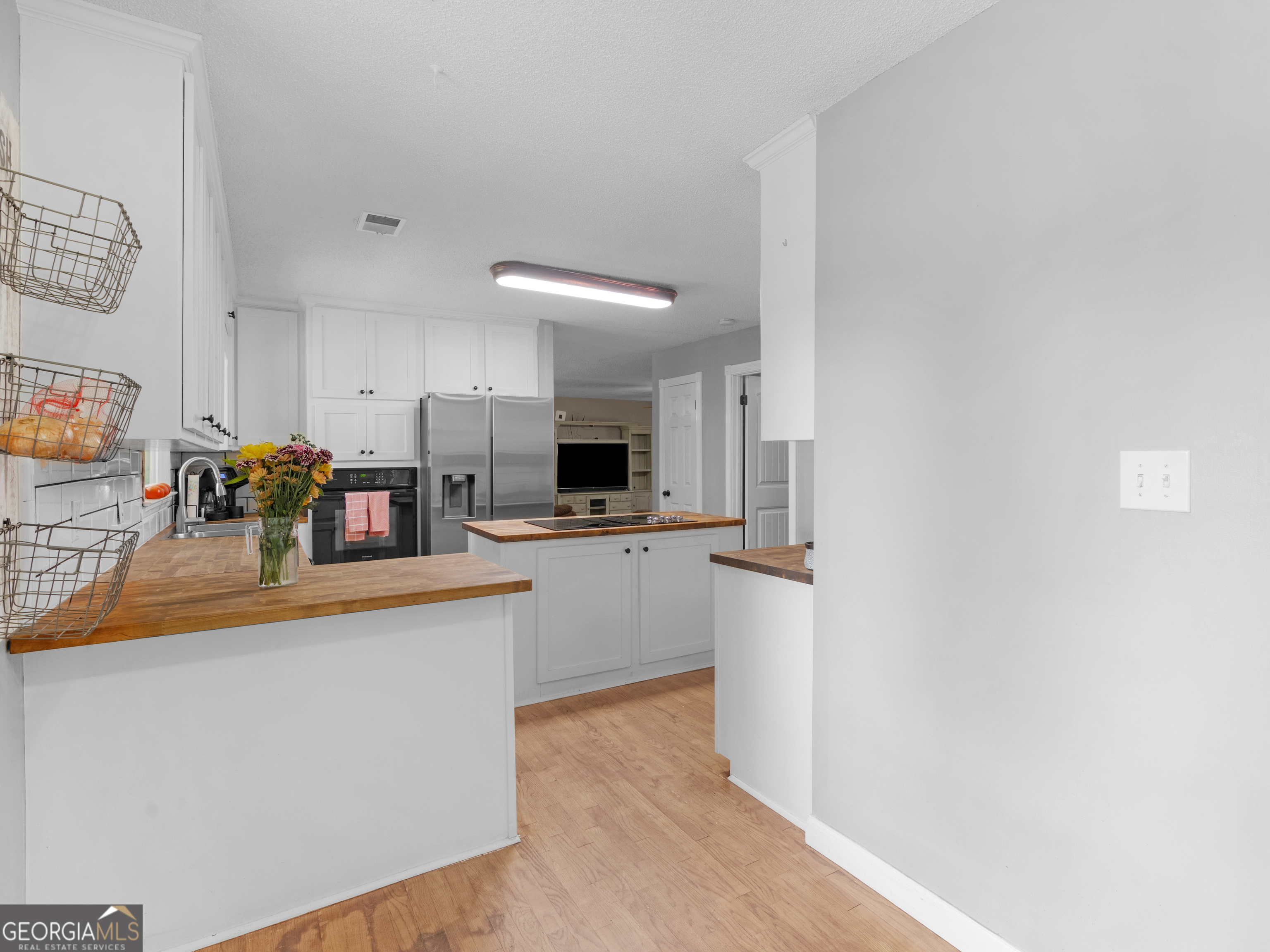 4939 Highway 19 Zebulon, GA 30295 - Photo 18 of 70 a kitchen with stainless steel appliances granite countertop a refrigerator and a stove top oven