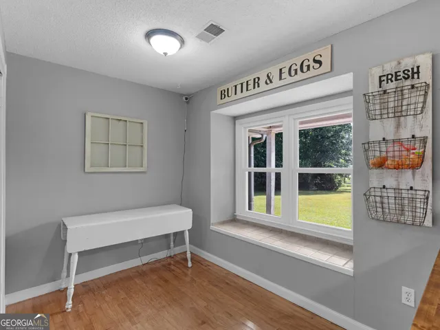 a bedroom with a bed and a shower