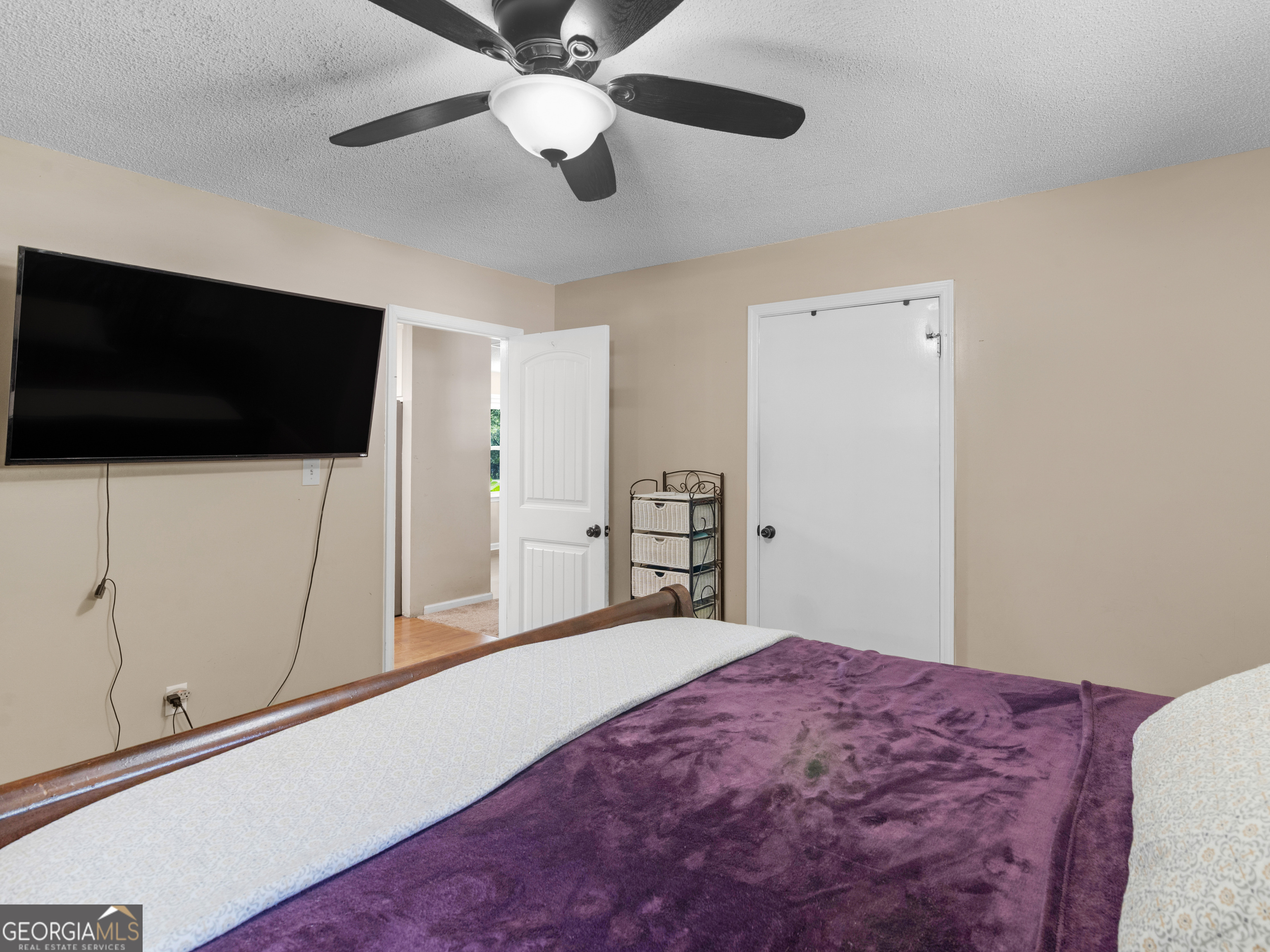 4939 Highway 19 Zebulon, GA 30295 - Photo 27 of 70 a bedroom with a bed and a flat screen tv