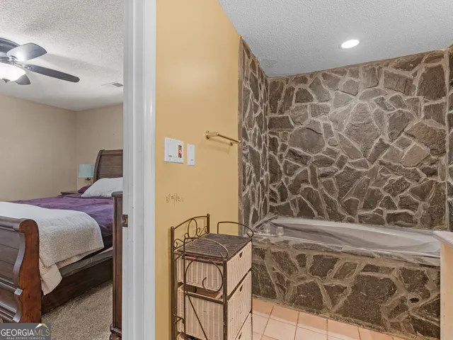 a bed room with furniture and a window