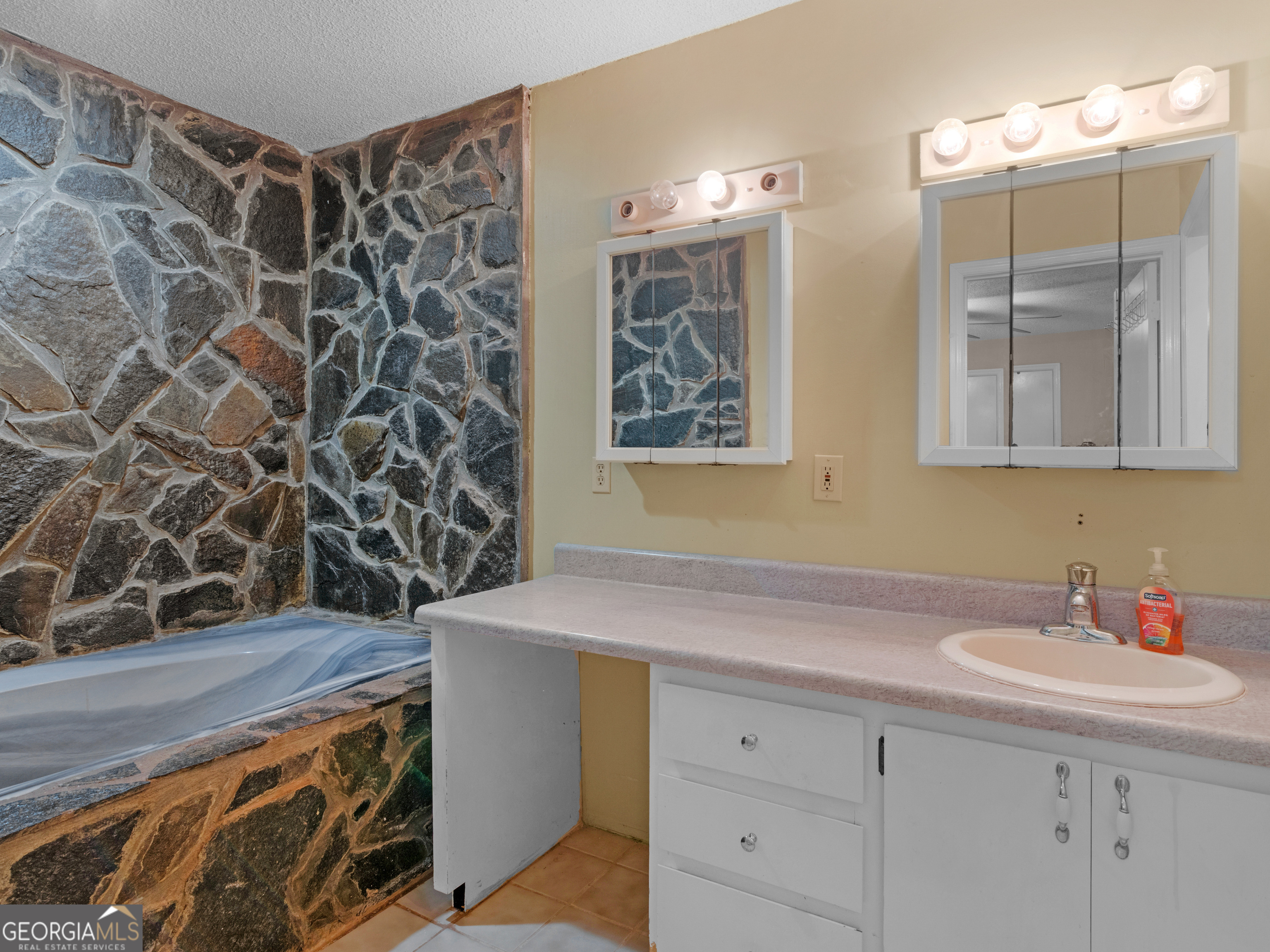 4939 Highway 19 Zebulon, GA 30295 - Photo 29 of 70 a bathroom with a sink and a mirror