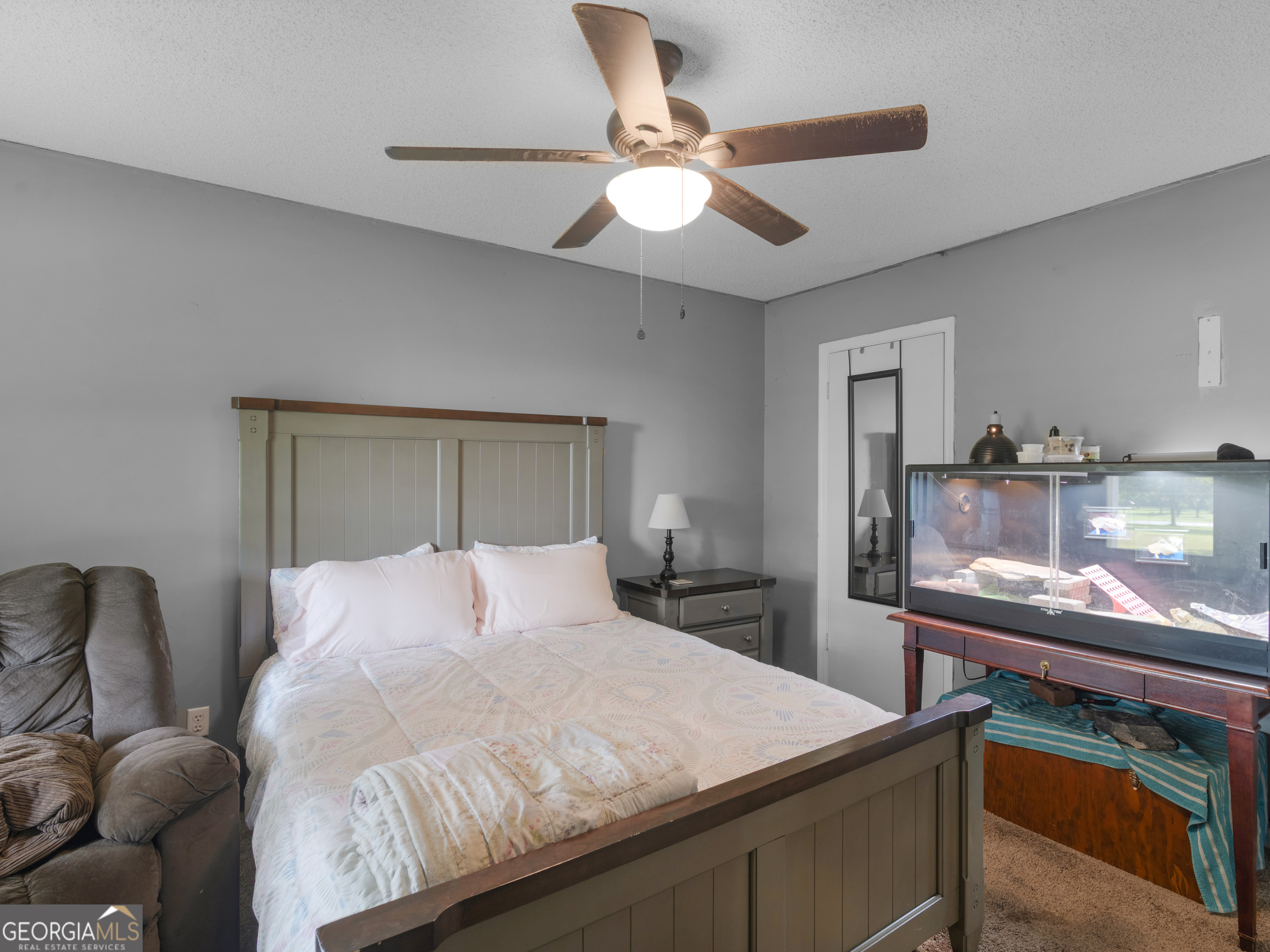 4939 Highway 19 Zebulon, GA 30295 - Photo 32 of 70 a bedroom with a bed and a dresser