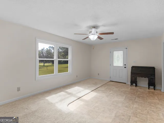 a view of cabinets and wooden floor