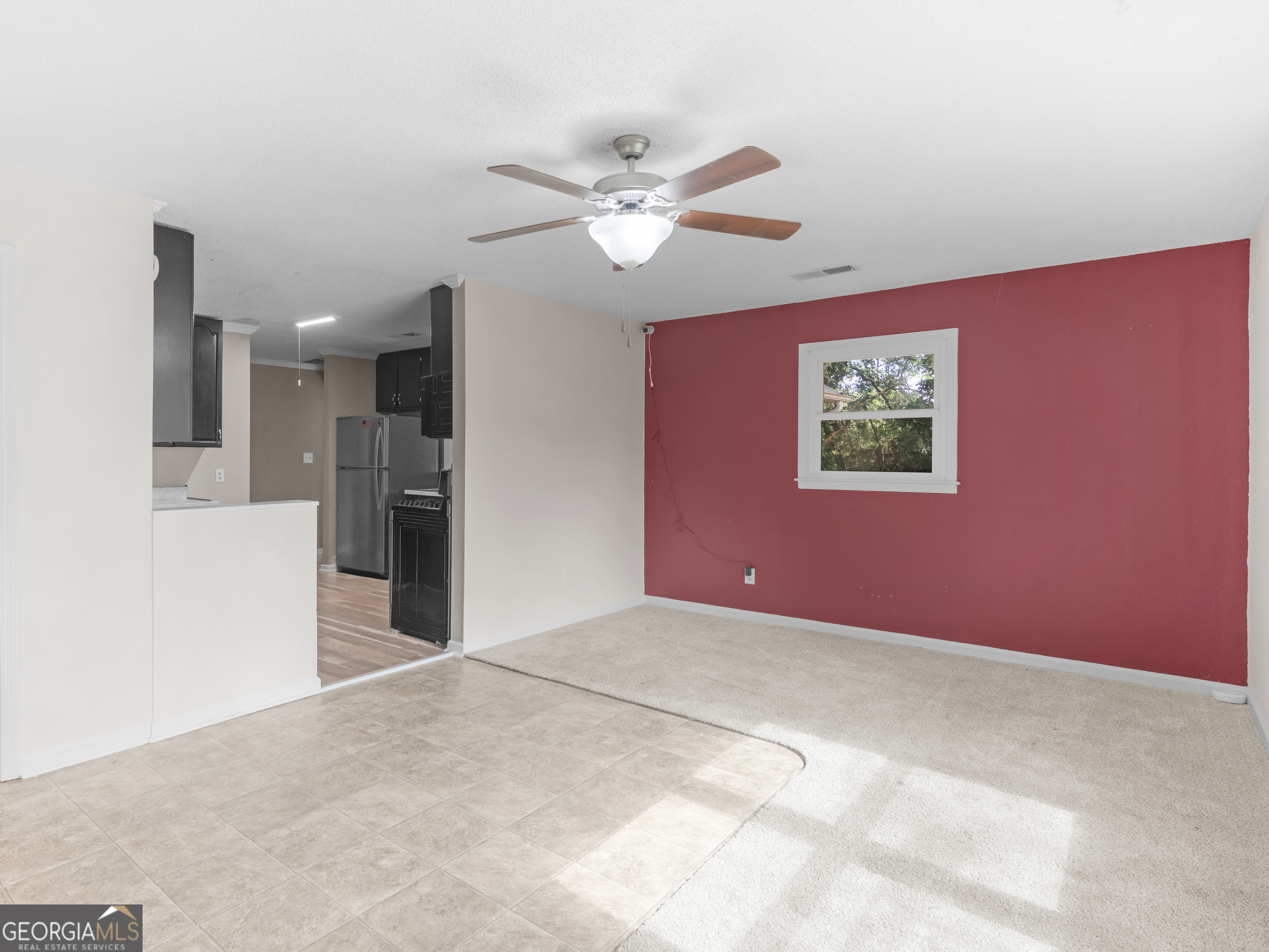 4939 Highway 19 Zebulon, GA 30295 - Photo 41 of 70 a view of a livingroom with a ceiling fan and window