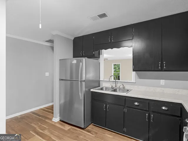 an aerial view of residential house with swimming pool and outdoor space