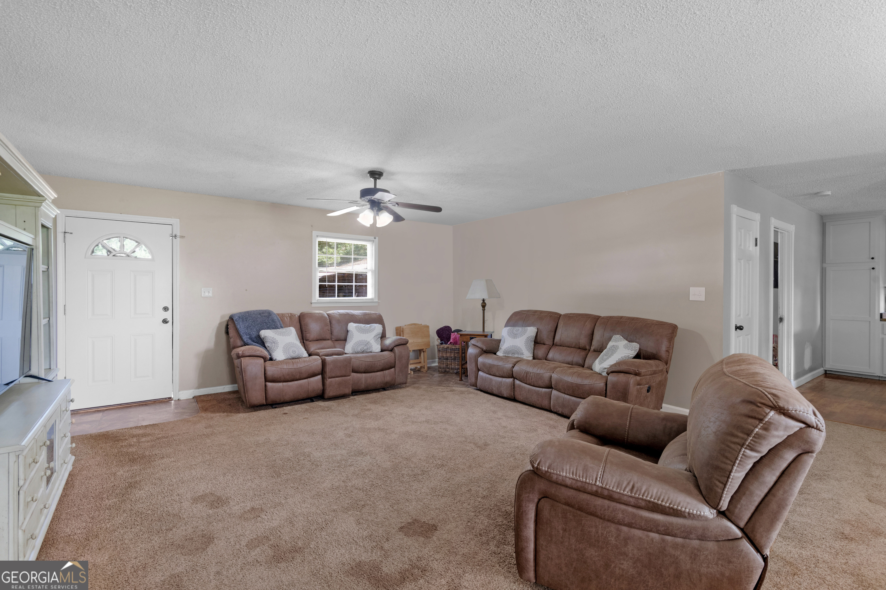 4939 Highway 19 Zebulon, GA 30295 - Photo 10 of 70 a living room with furniture and a chandelier