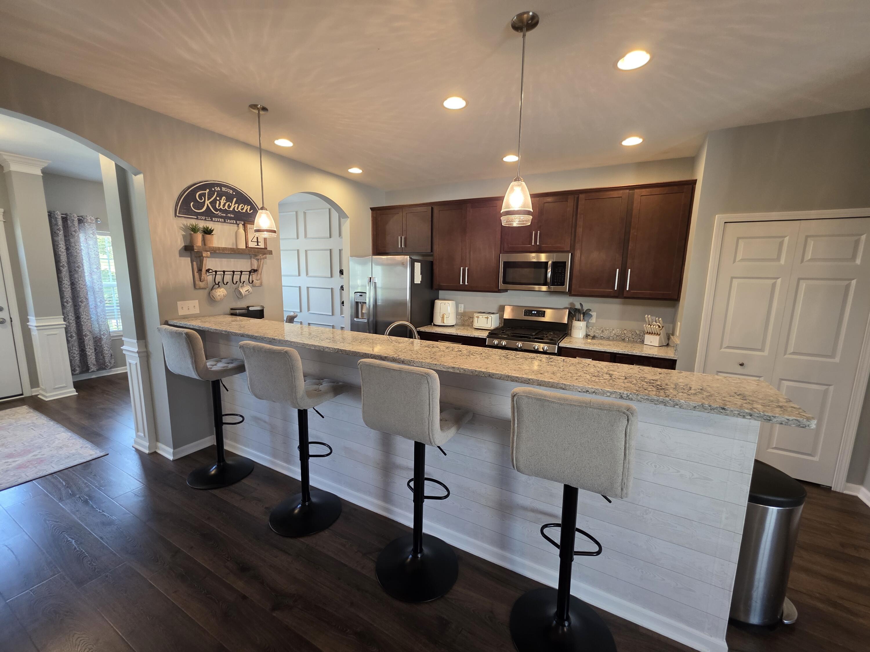11558 Kentucky Street Crown Point, IN 46307 - Photo 14 of 39 a kitchen with counter space appliances and wooden floor