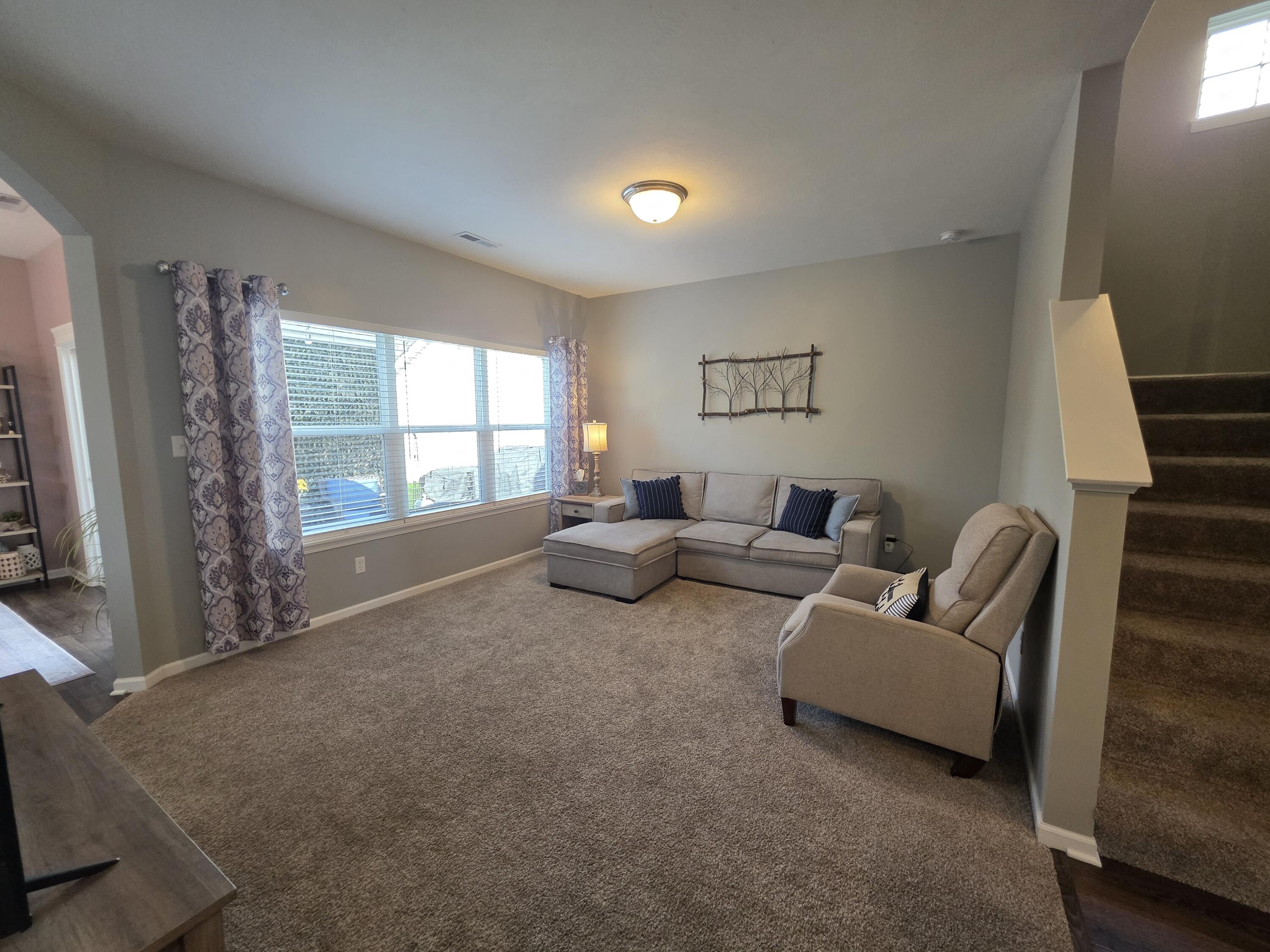 11558 Kentucky Street Crown Point, IN 46307 - Photo 16 of 39 a living room with furniture and a window