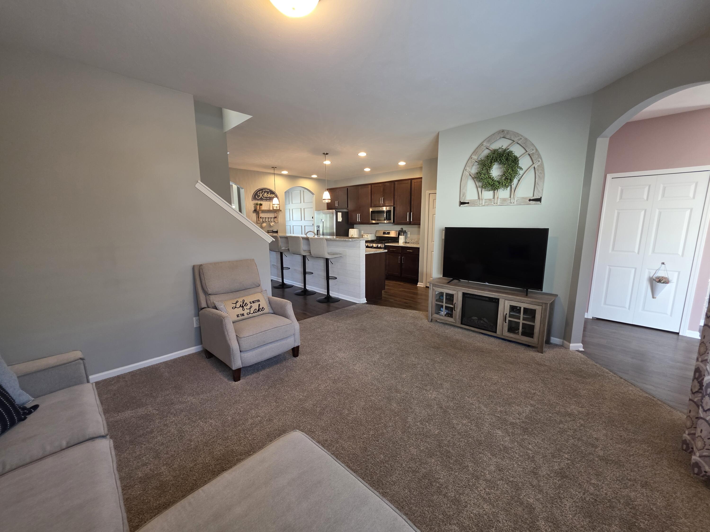 11558 Kentucky Street Crown Point, IN 46307 - Photo 17 of 39 a view of living room with furniture and a flat screen tv