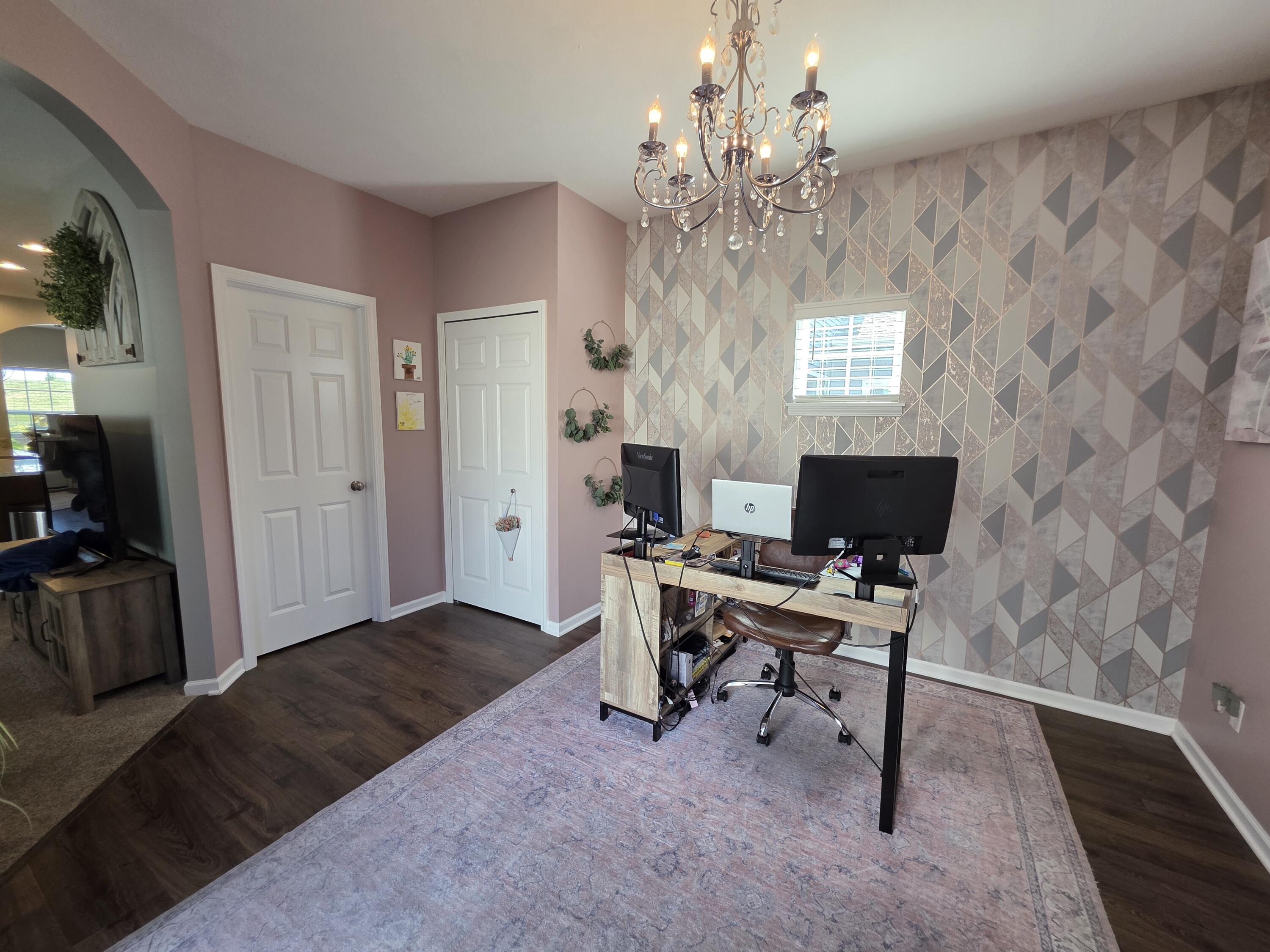 11558 Kentucky Street Crown Point, IN 46307 - Photo 19 of 39 a view of a livingroom with workspace and a window