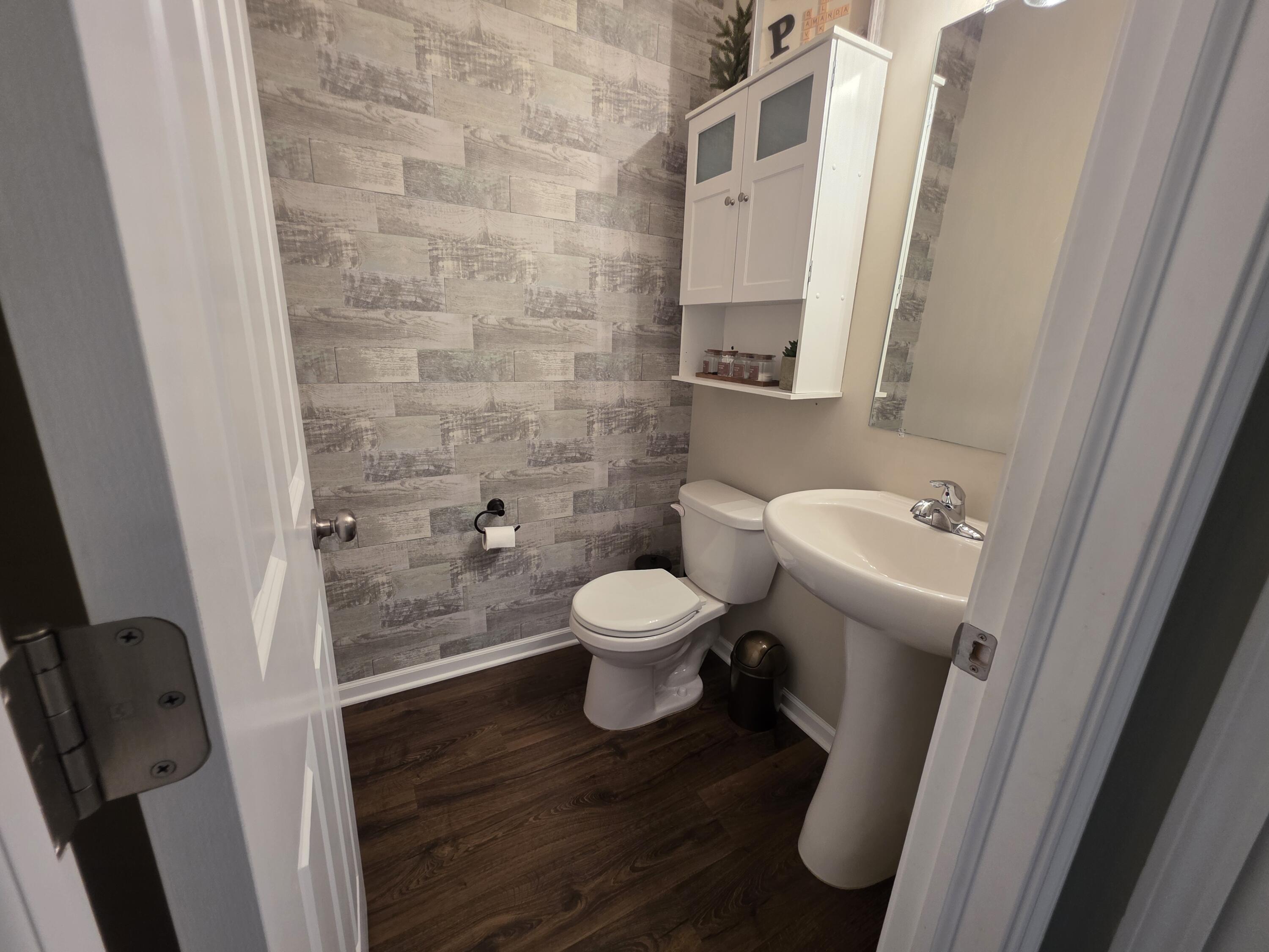 11558 Kentucky Street Crown Point, IN 46307 - Photo 20 of 39 a bathroom with a toilet and a sink