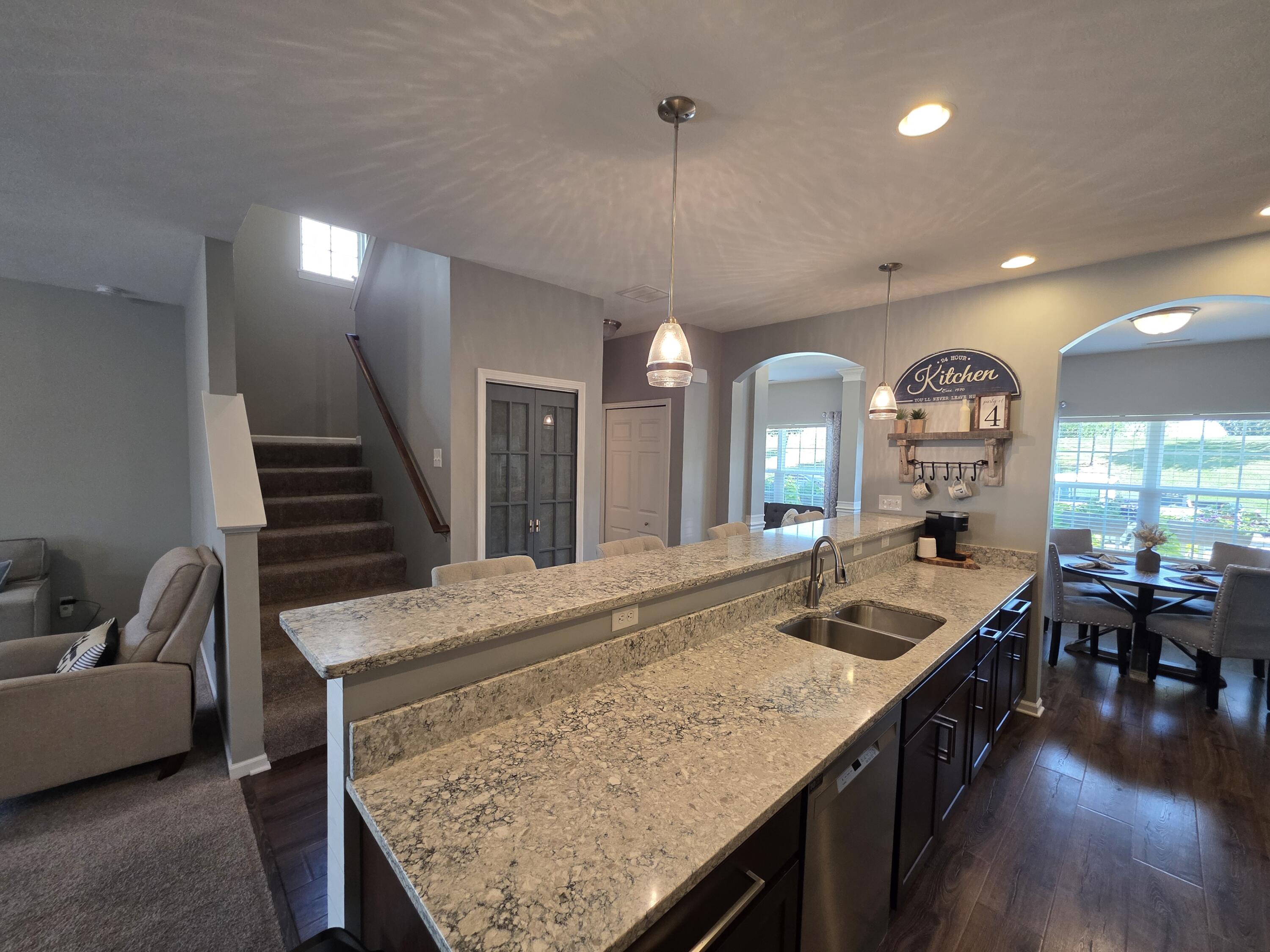 11558 Kentucky Street Crown Point, IN 46307 - Photo 21 of 39 a view of living room and kitchen with furniture