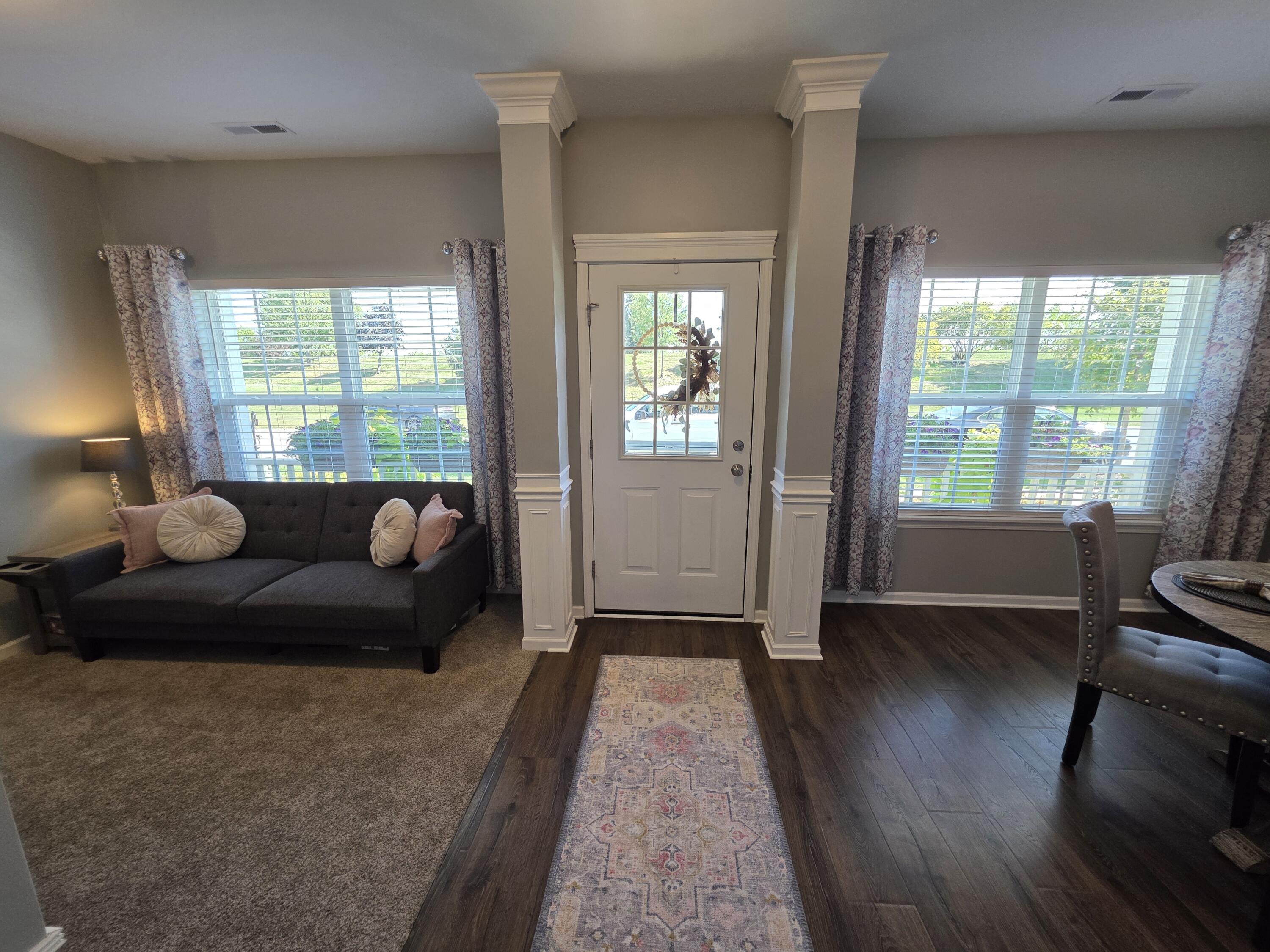 11558 Kentucky Street Crown Point, IN 46307 - Photo 3 of 39 a living room with furniture and a large window