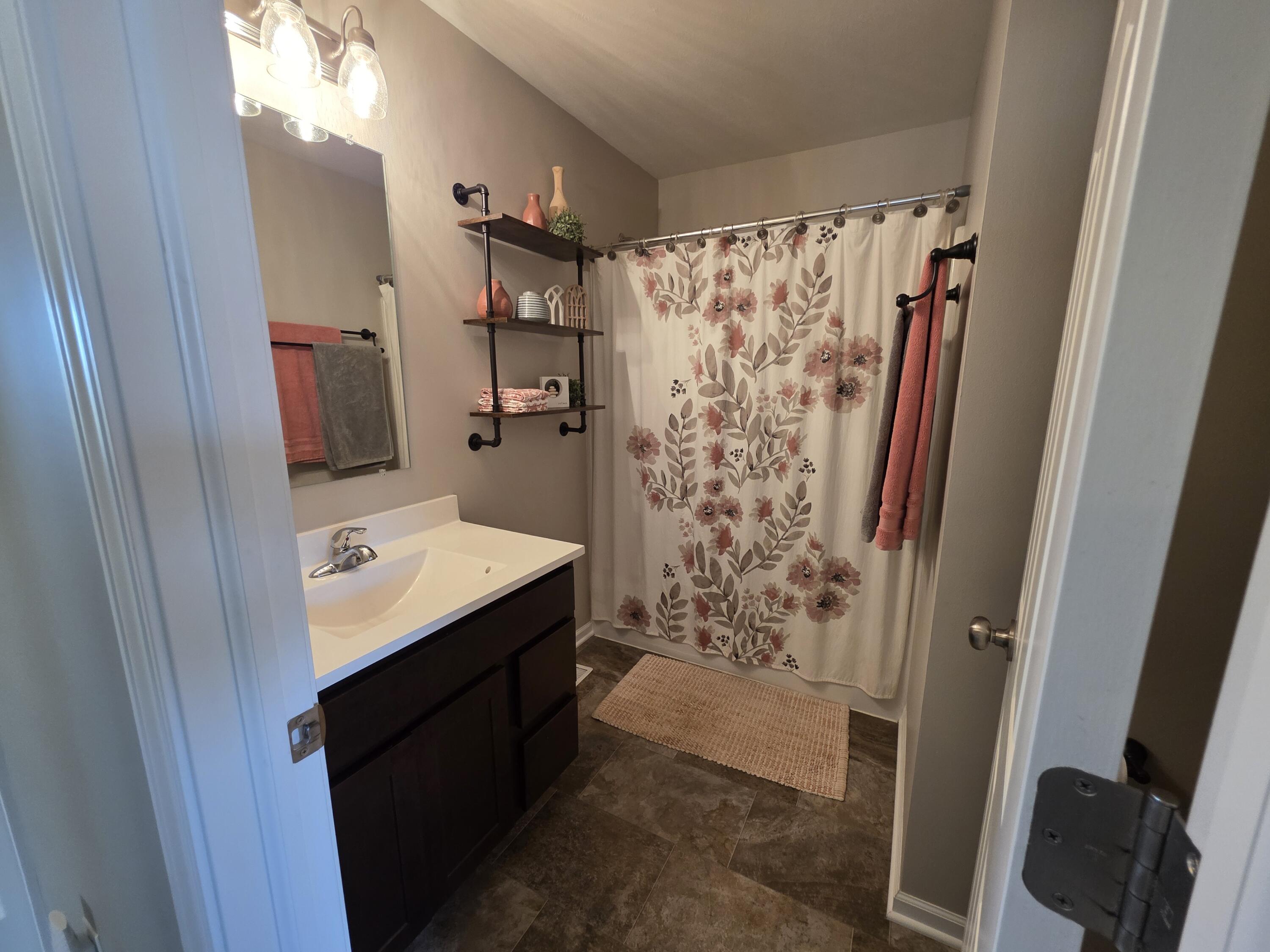 11558 Kentucky Street Crown Point, IN 46307 - Photo 31 of 39 a bathroom with a sink a toilet and shower