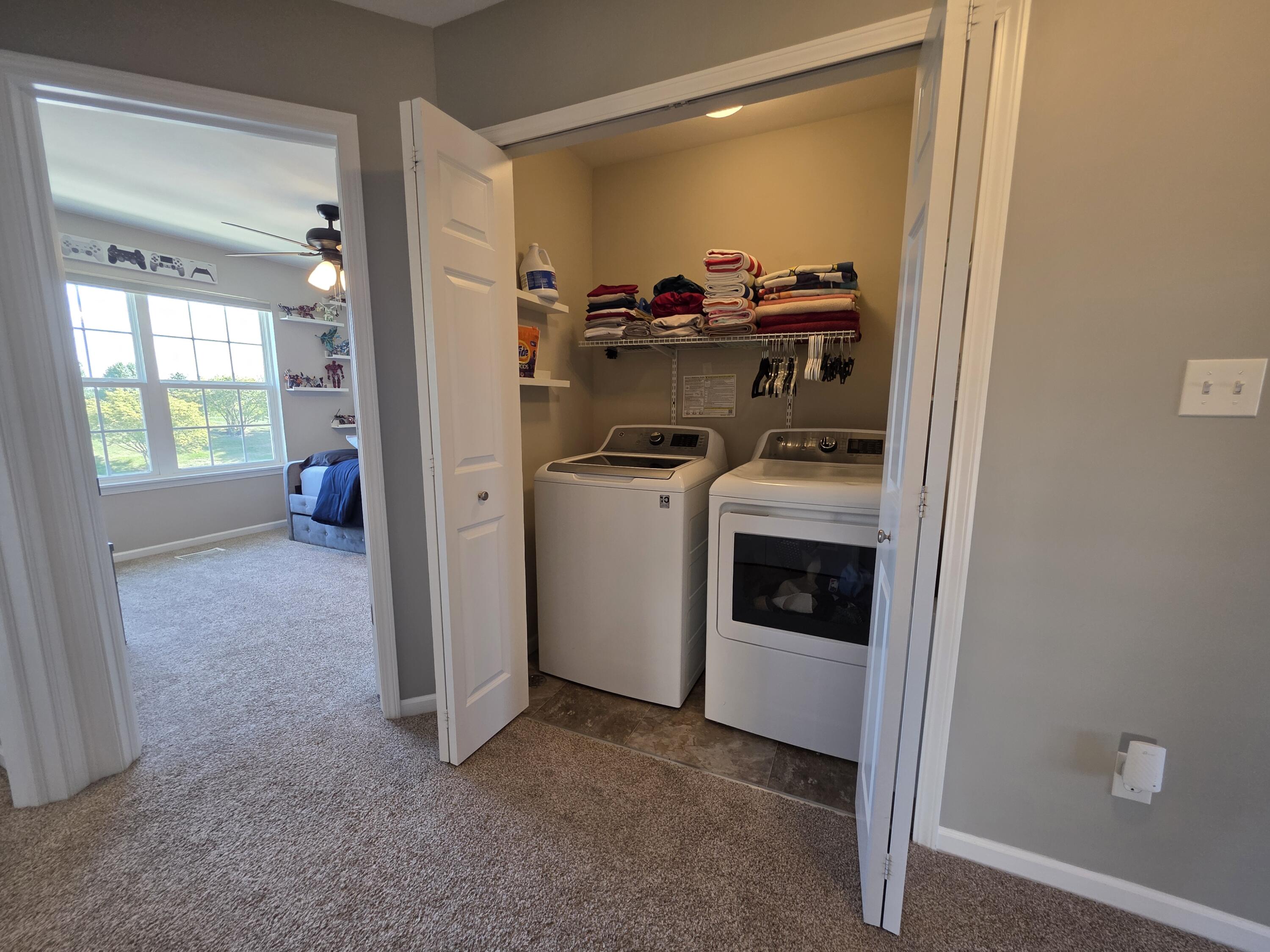 11558 Kentucky Street Crown Point, IN 46307 - Photo 34 of 39 a view of a storage and utility room with washer and dryer