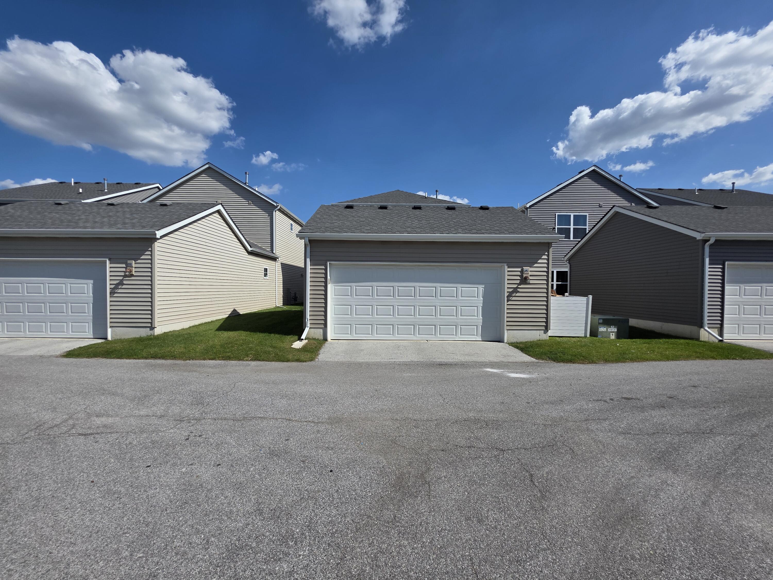 11558 Kentucky Street Crown Point, IN 46307 - Photo 38 of 39 a front view of a house with a yard and garage