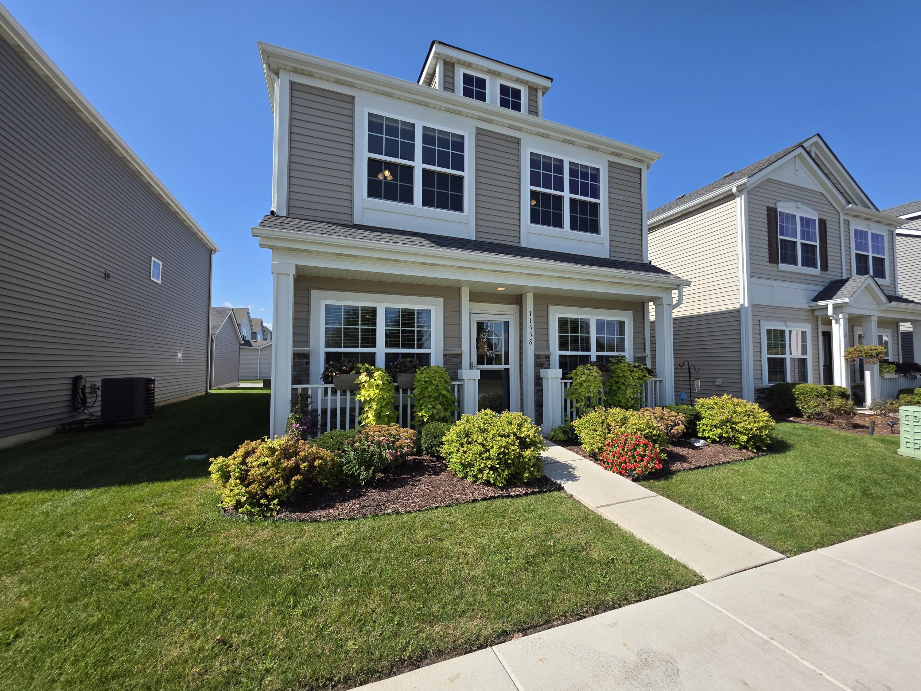 11558 Kentucky Street Crown Point, IN 46307 - Photo 39 of 39 a front view of a house with a yard