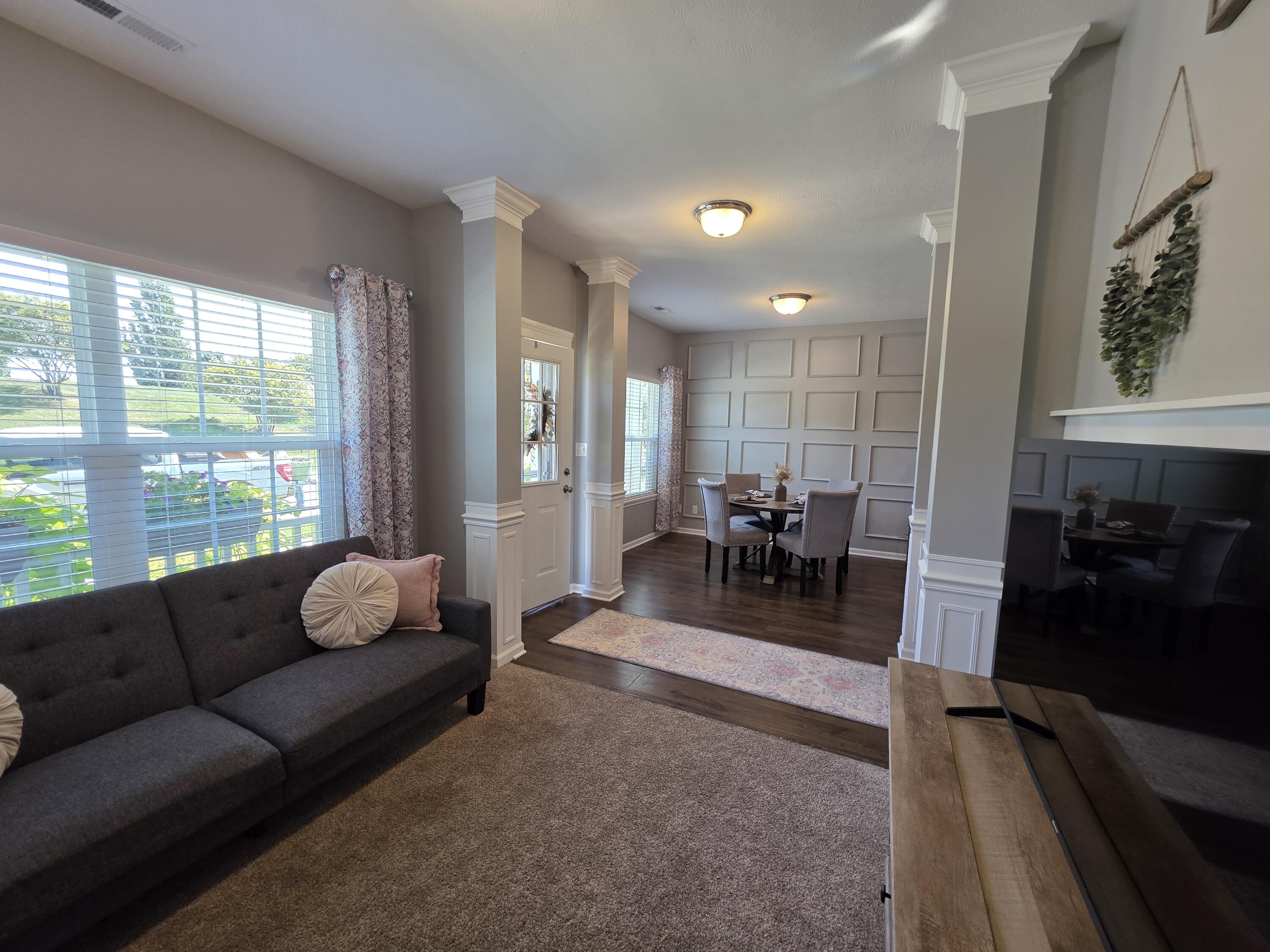 11558 Kentucky Street Crown Point, IN 46307 - Photo 5 of 39 a living room with furniture and a large window