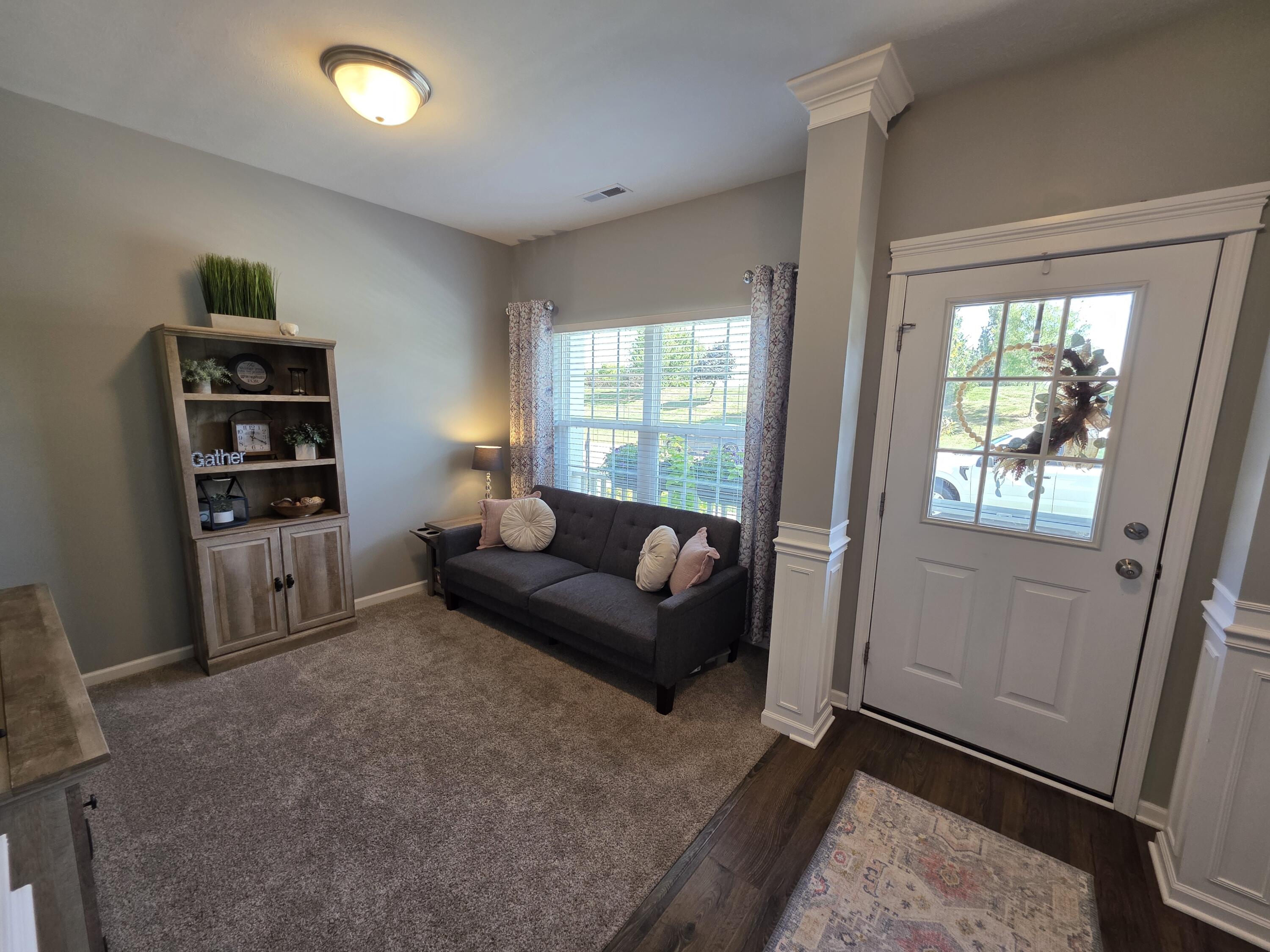 11558 Kentucky Street Crown Point, IN 46307 - Photo 8 of 39 a living room with furniture and a window