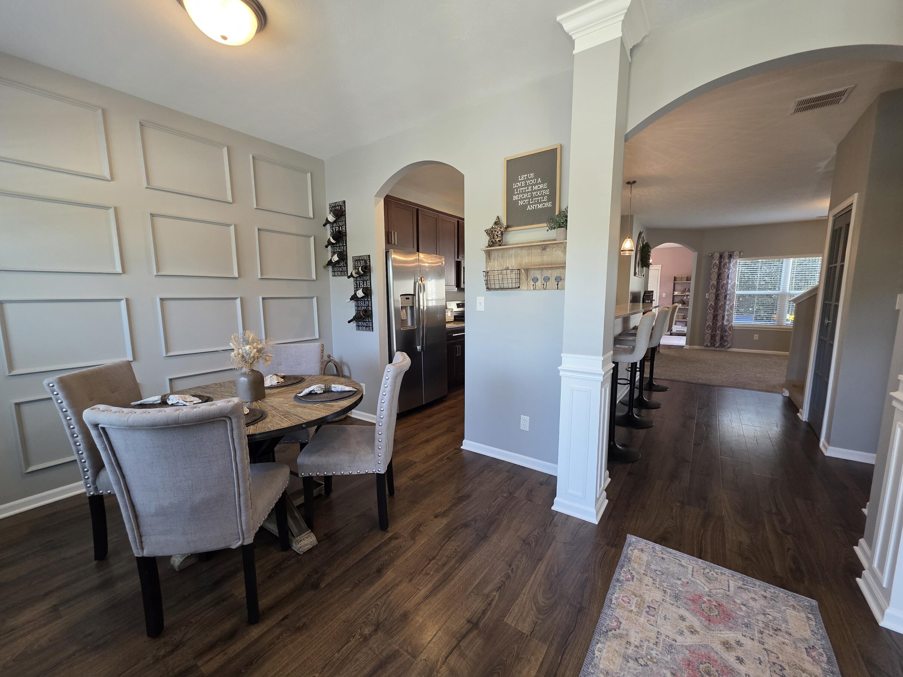 11558 Kentucky Street Crown Point, IN 46307 - Photo 10 of 39 a dining room with furniture and wooden floor