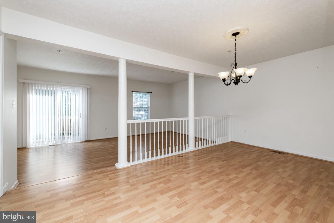 9319 Ridings Way Laurel, MD 20723 - Photo 15 of 44 Dining with step down to living room