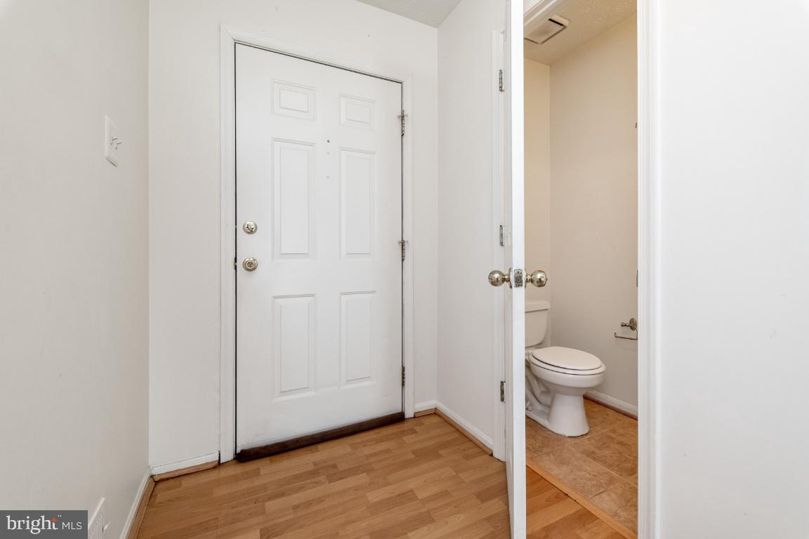 9319 Ridings Way Laurel, MD 20723 - Photo 8 of 44 Front door & powder room