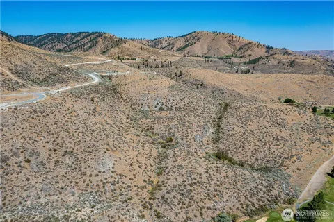 a view of mountain and a field