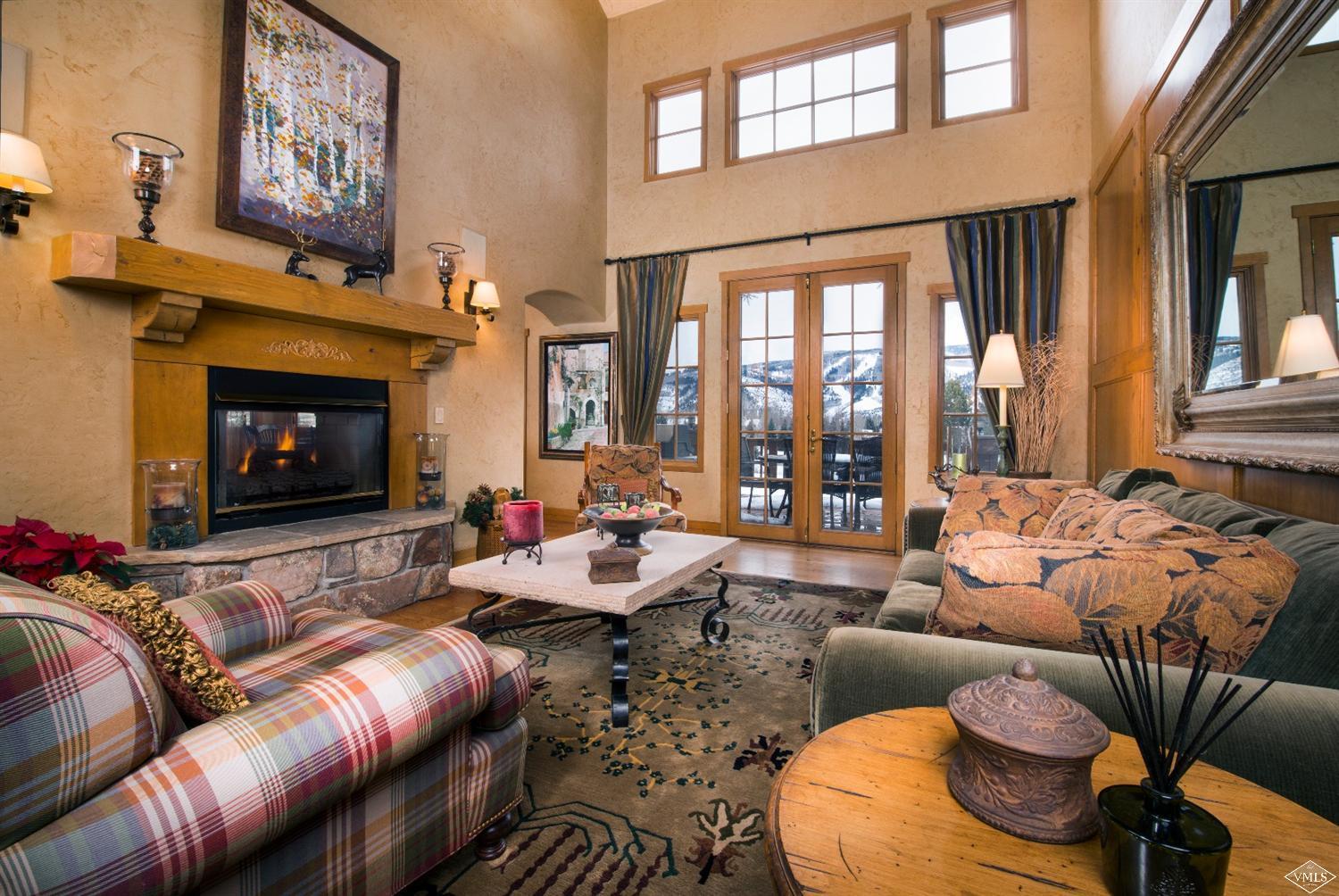35 Buckboard Road Edwards, CO 81632 - Photo 1 of 21 a living room with furniture fireplace and a large window