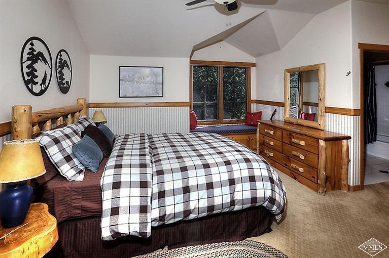 35 Buckboard Road Edwards, CO 81632 - Photo 12 of 21 a bedroom with a bed and wooden floor