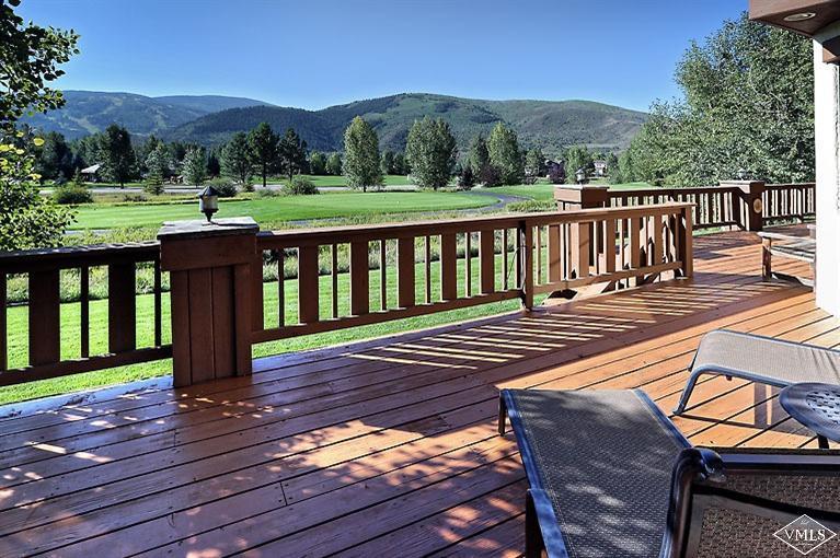 35 Buckboard Road Edwards, CO 81632 - Photo 16 of 21 a view of a wooden deck with a bench