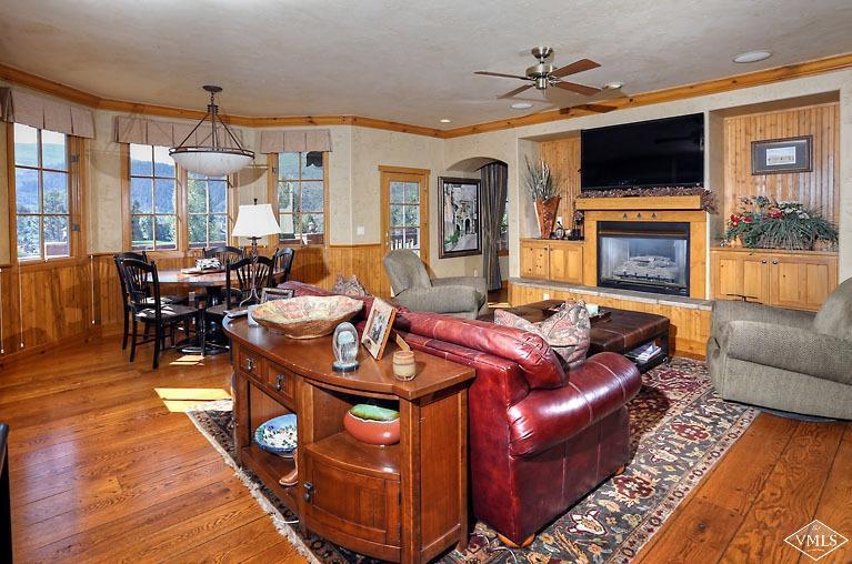 35 Buckboard Road Edwards, CO 81632 - Photo 3 of 21 a living room with furniture a flat screen tv and a fireplace