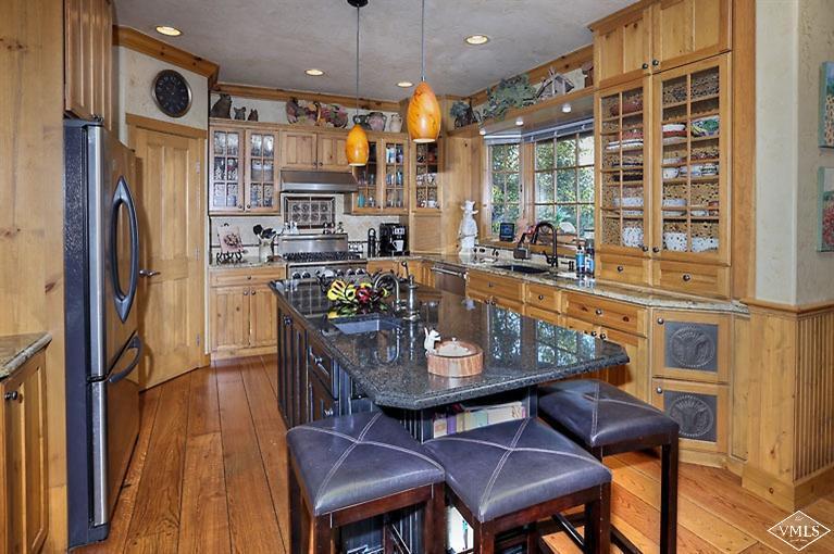 35 Buckboard Road Edwards, CO 81632 - Photo 4 of 21 a view of a dining room with furniture window and wooden floor