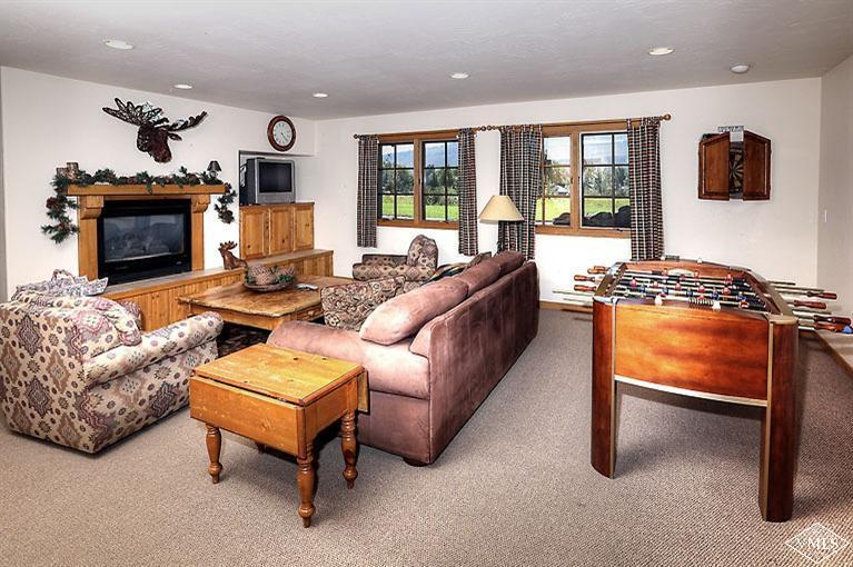 35 Buckboard Road Edwards, CO 81632 - Photo 7 of 21 a living room with furniture fireplace and flat screen tv