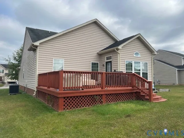 a view of backyard with deck and deck